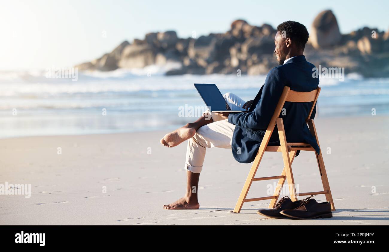 Beach, work and black man reading an email on a laptop with 5g