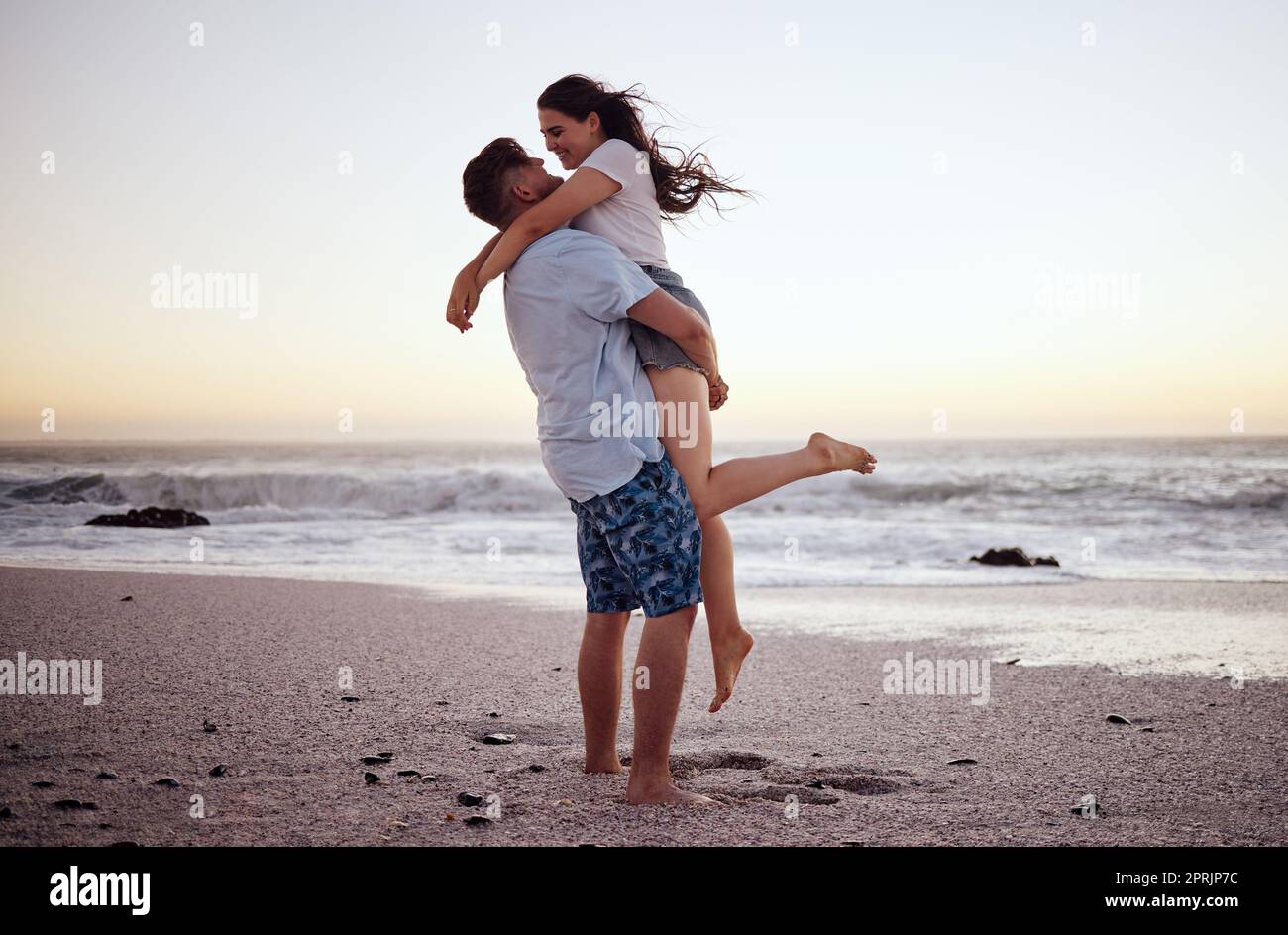 A couple in love in the field on beautiful sky background. Profile