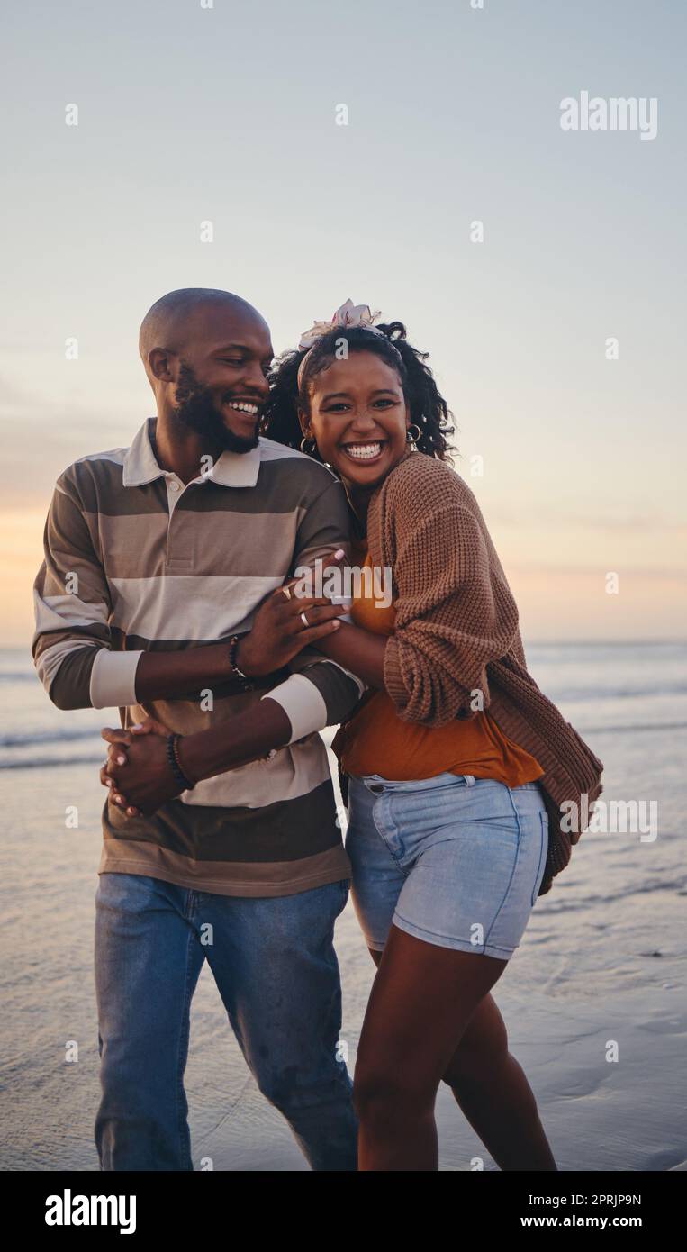 Happy, black couple, love and beach with smile for vacation in