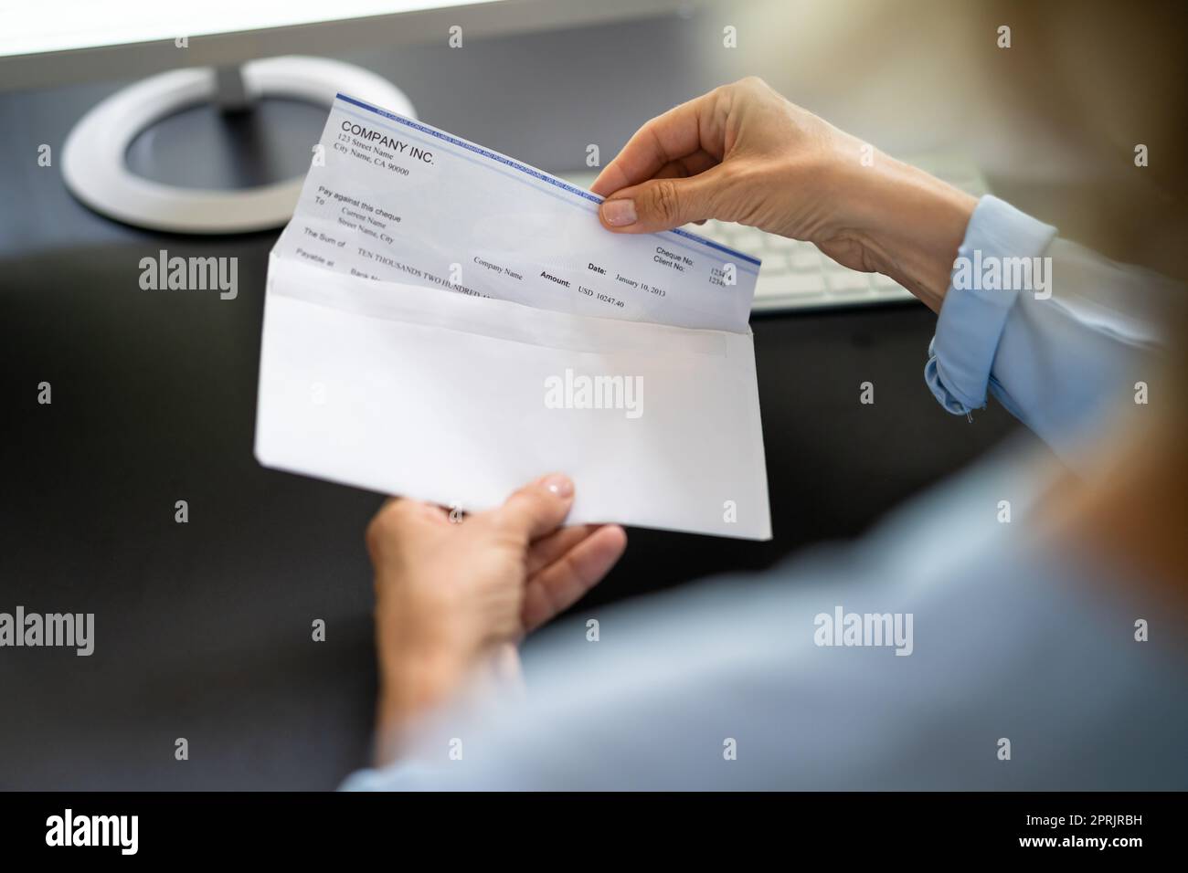Payroll Cheque In Envelope. Woman Hand Holding Paycheck Stock Photo Alamy