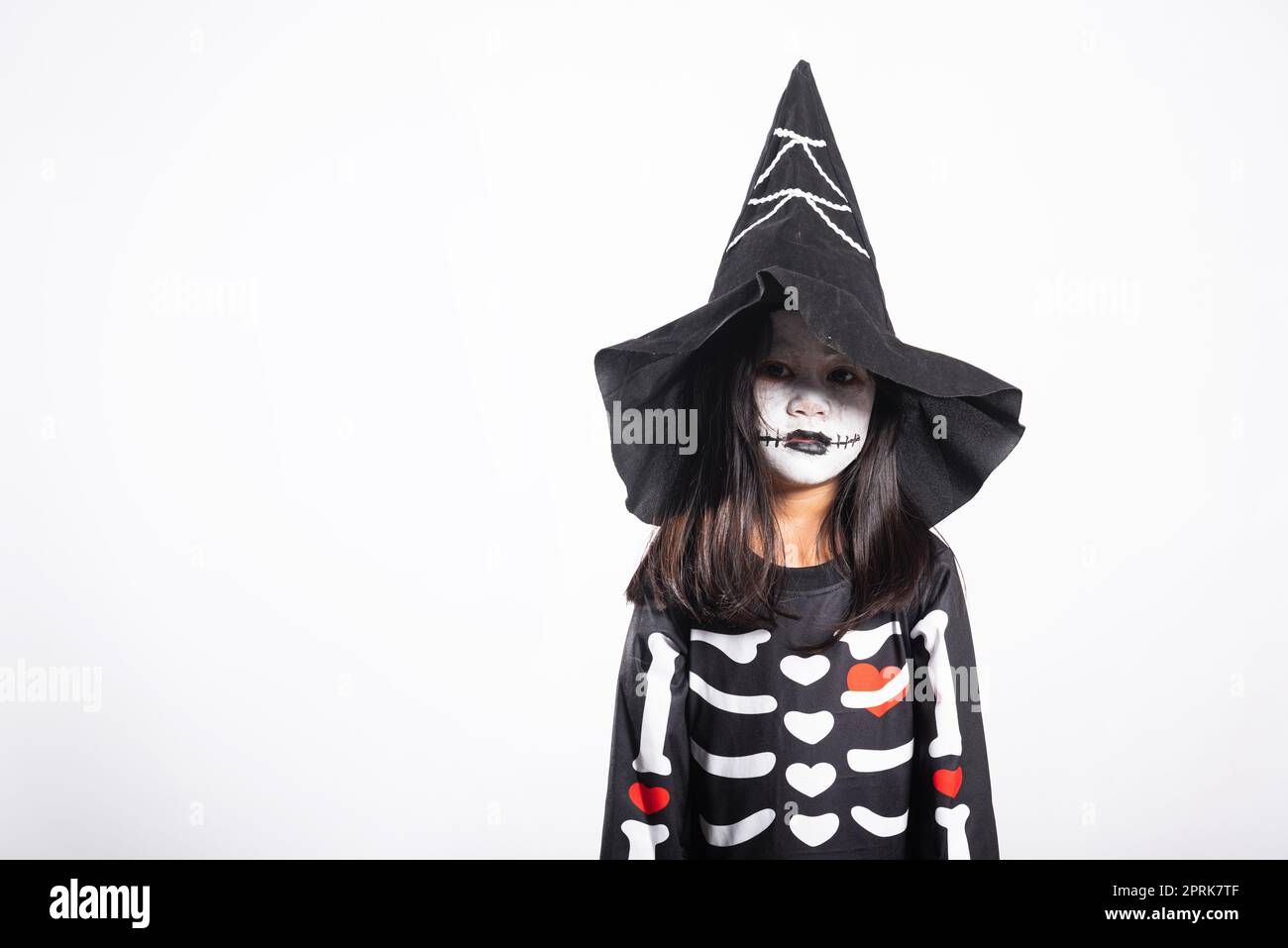 length portrait against a white background of a woman with green body paint  dressed up in a witch costume for Halloween making a scary face at camera  Stock Photo - Alamy