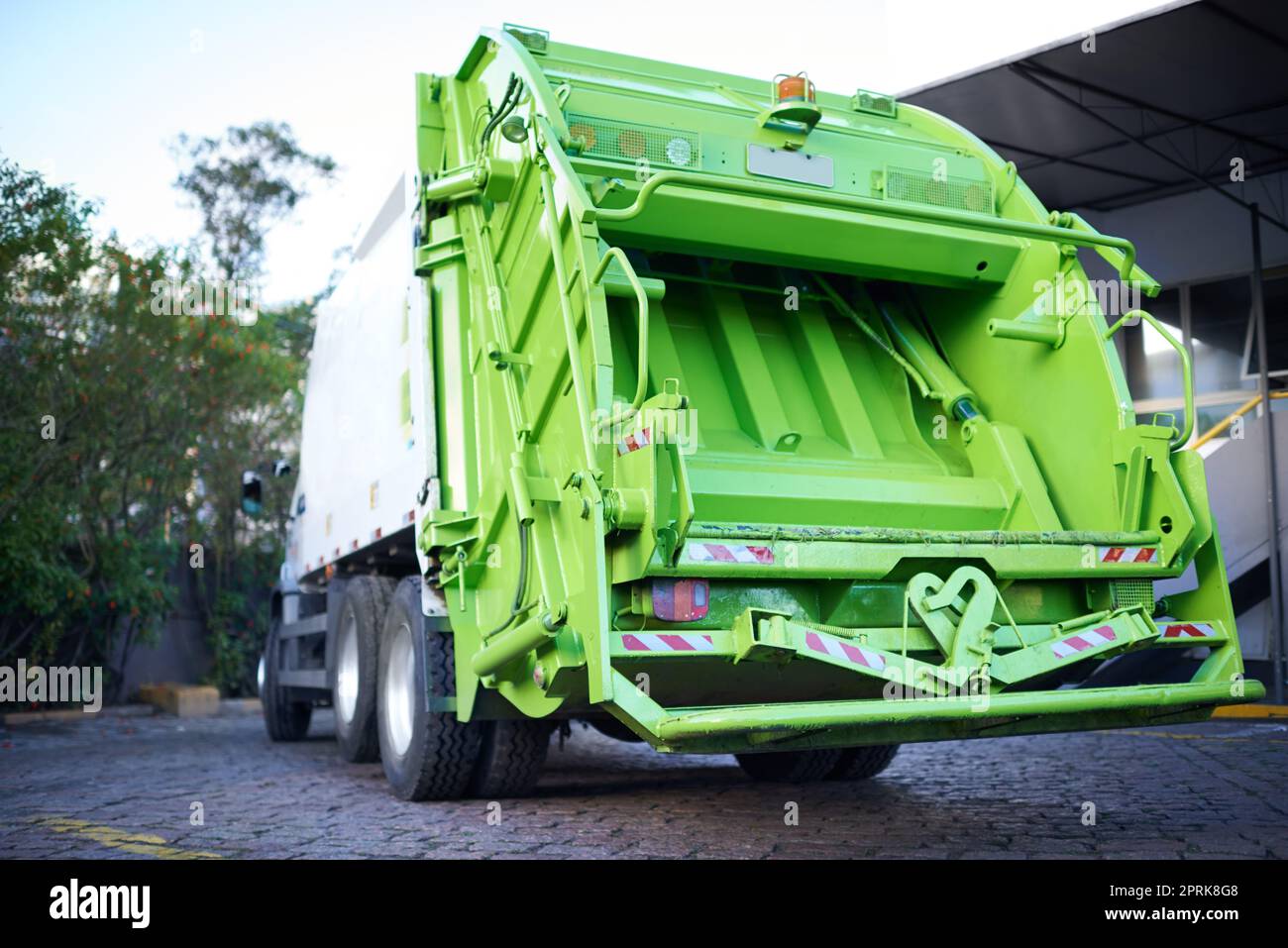Collecting your trash. a garbage removal service Stock Photo Alamy