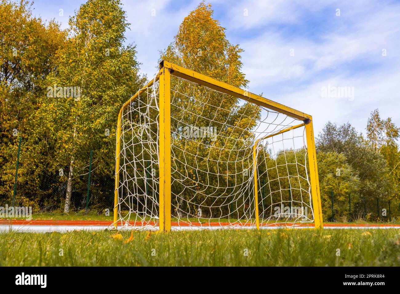 https://c8.alamy.com/comp/2PRK8R4/small-yellow-football-goals-in-a-stadium-during-autumn-season-football-goals-for-kids-training-2PRK8R4.jpg