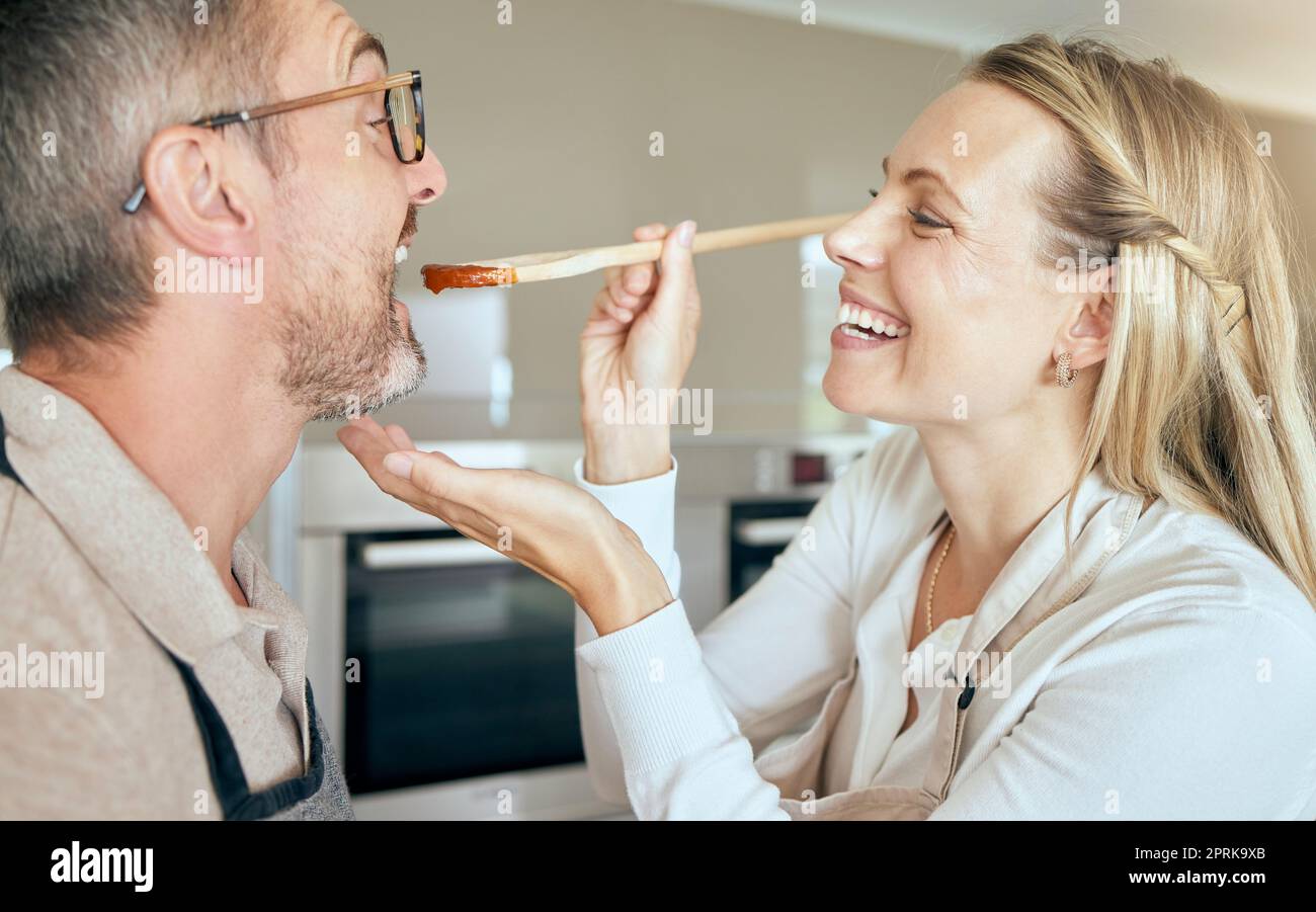 https://c8.alamy.com/comp/2PRK9XB/cooking-woman-feed-man-to-taste-food-meal-and-lunch-in-kitchen-at-home-happy-smile-and-care-wife-giving-hungry-and-tasting-husband-mouth-spoon-of-2PRK9XB.jpg