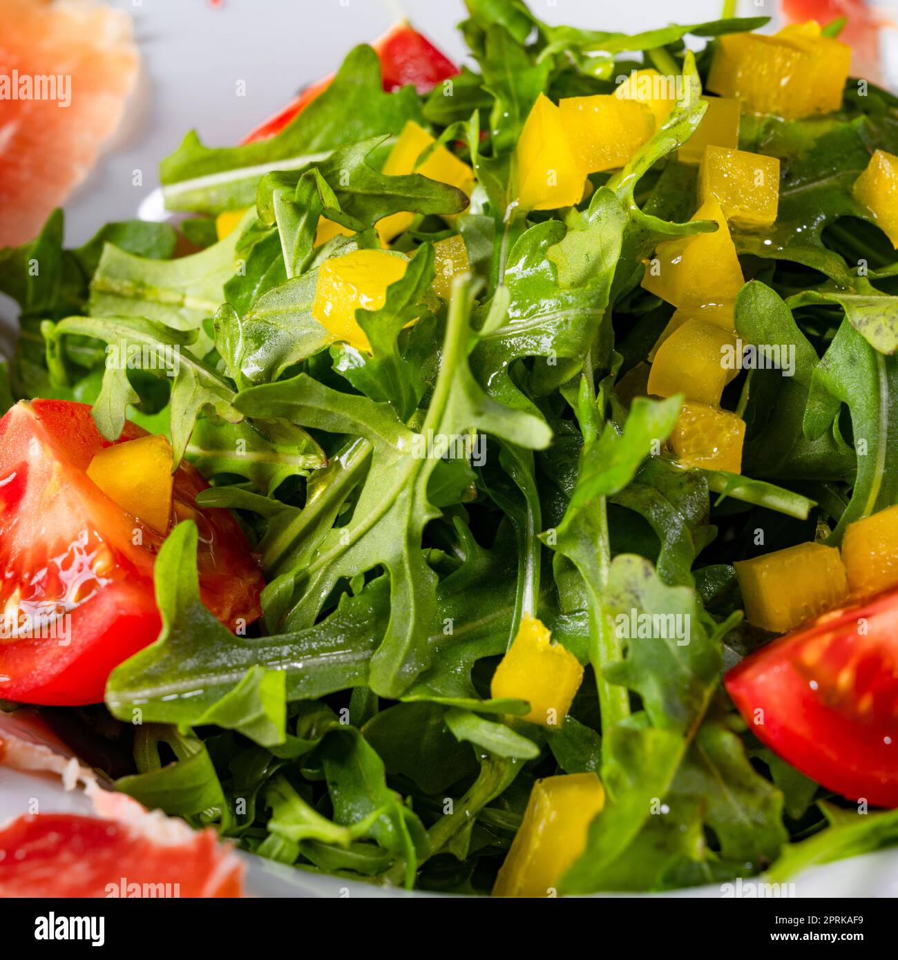 Rocket salad with dried Spanish ham Stock Photo Alamy