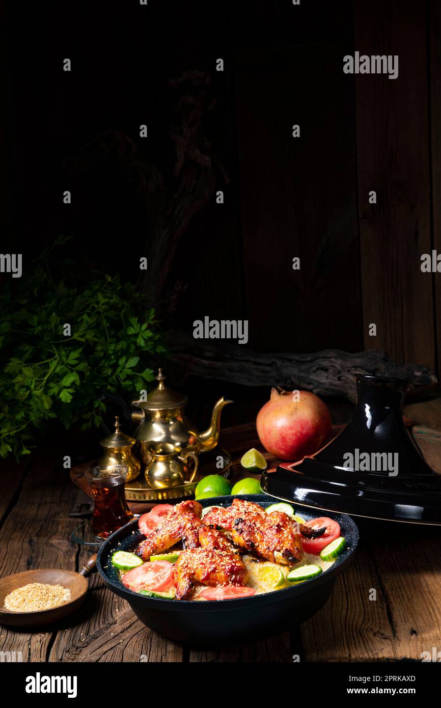 couscous with fried chicken wings spicy Stock Photo Alamy