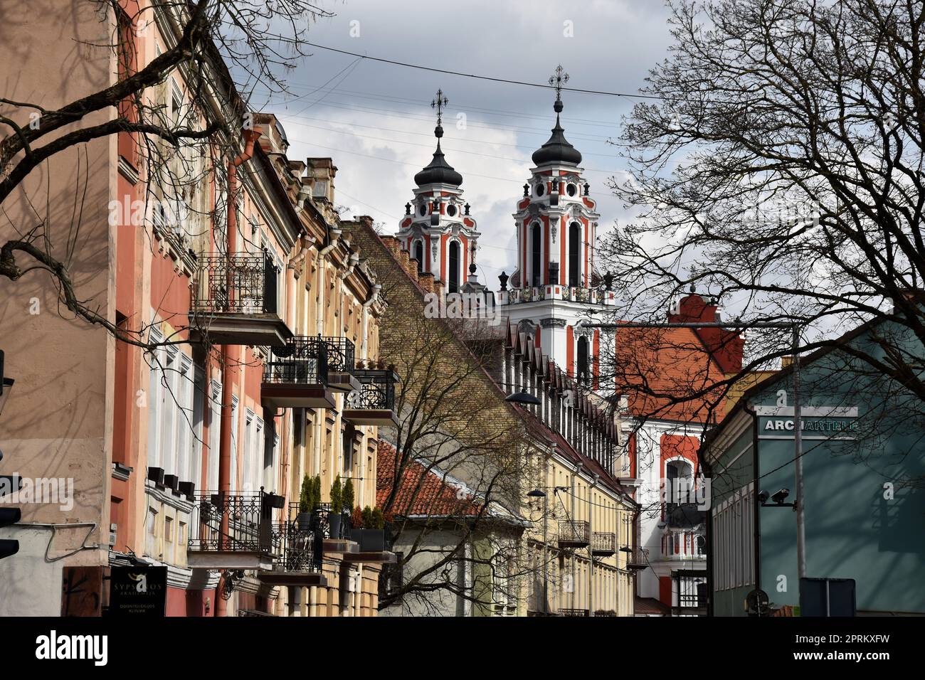 Vilnius, capital of Lithuania: old street with baroque church Stock Photo