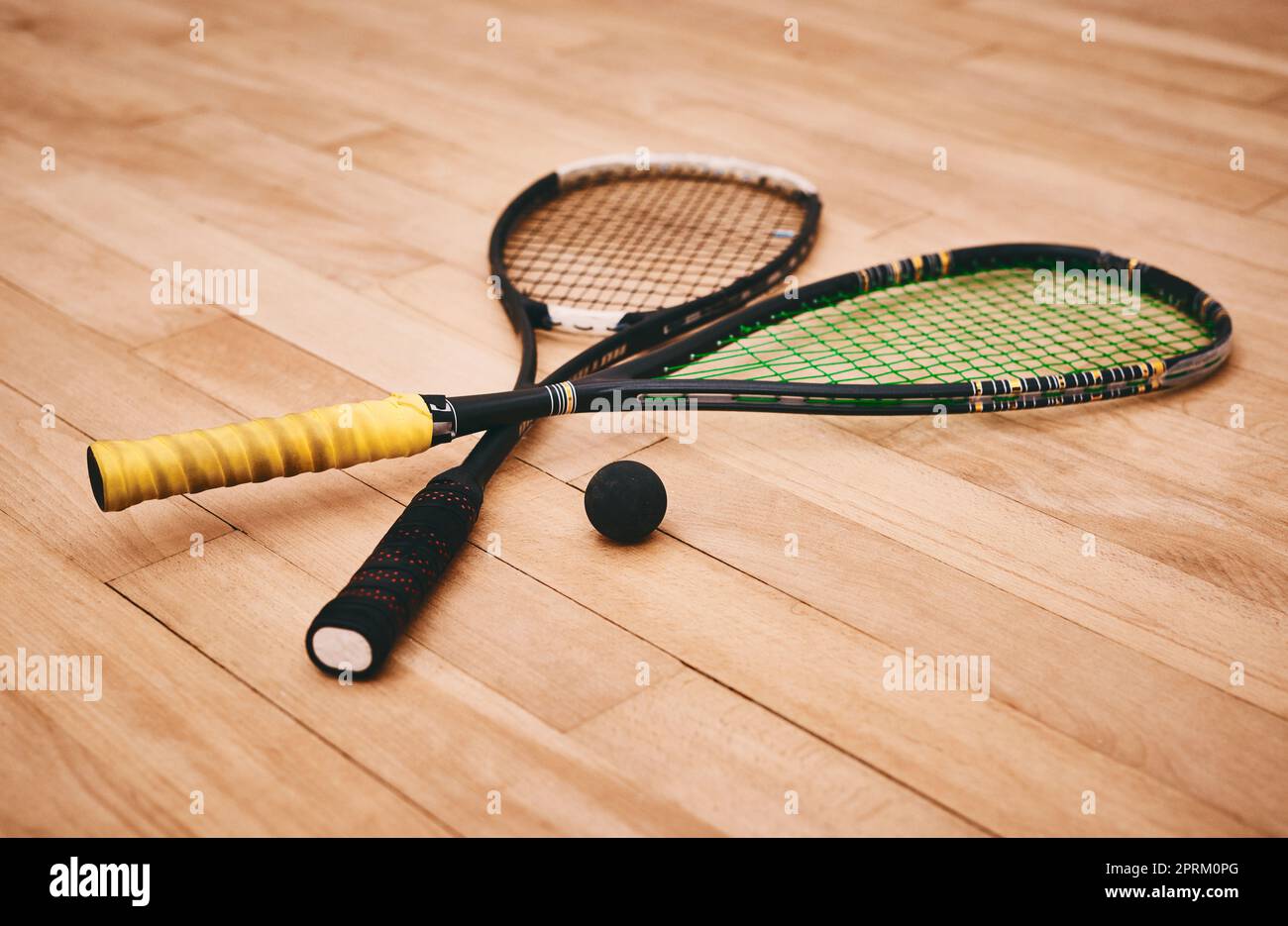 Whipping squash balls into a frenzy is what we do. two squash racquets