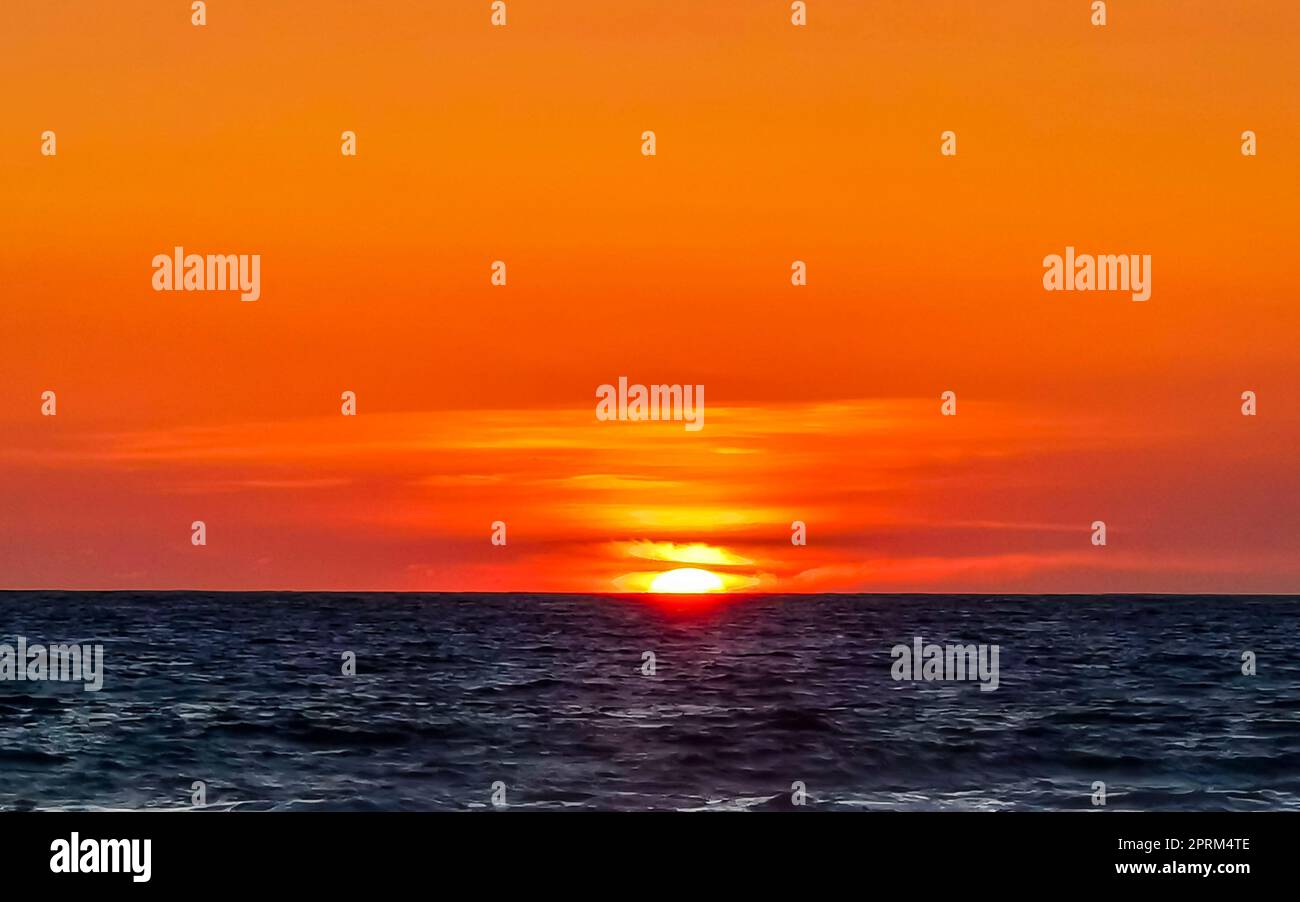 Beautiful stunning colorful and golden sunset in yellow orange red on