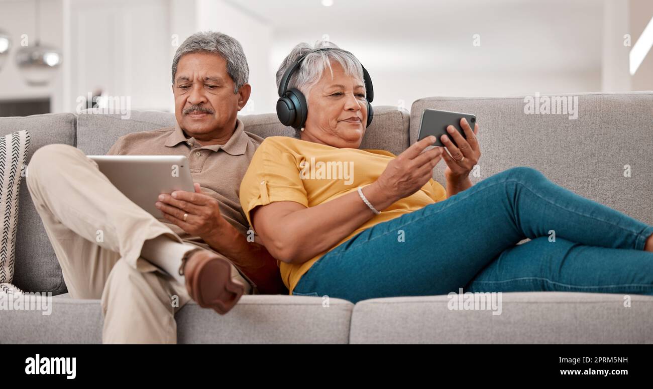 Senior couple, relax with technology and tablet, smartphone and