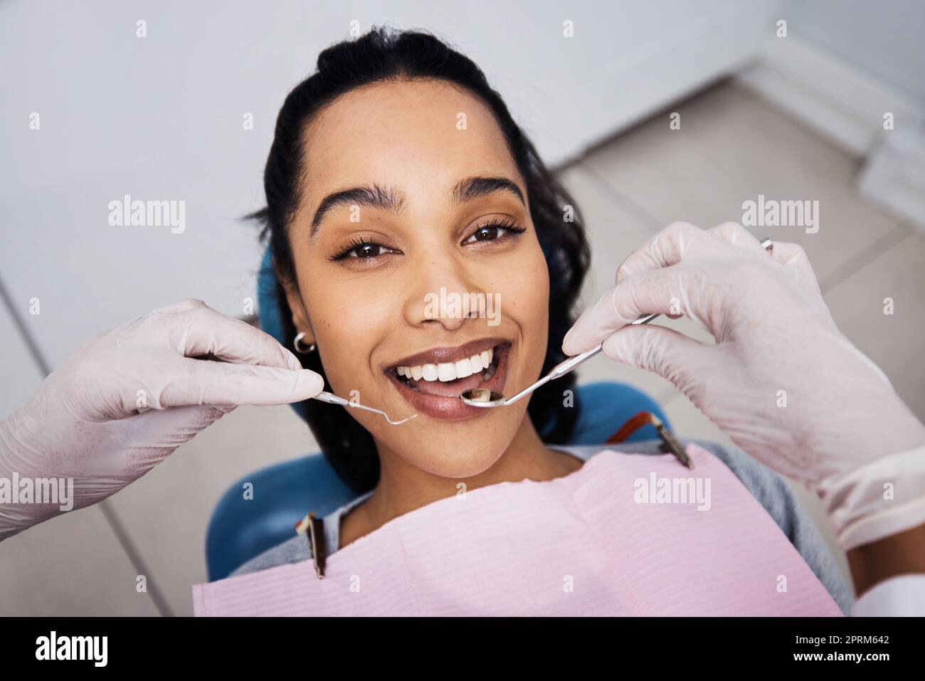 Going to the dentist has never felt so good. a young woman having dental work done on her teeth Stock Photo