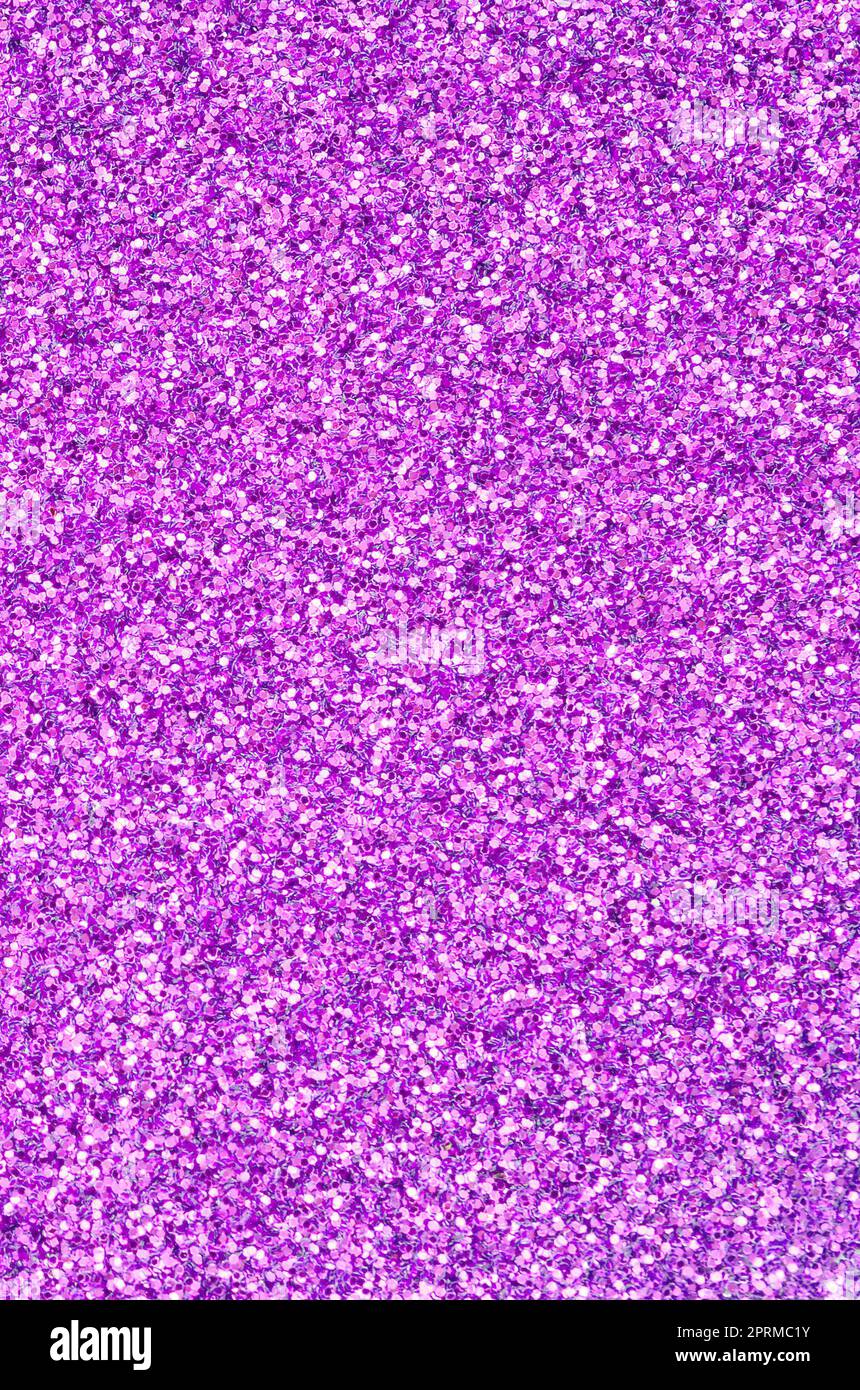 Purple decorative sequins. Background image with shiny bokeh lights
