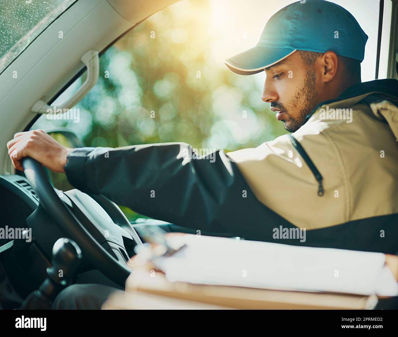 Making his rounds. a courier making deliveries in his van. Stock Photo