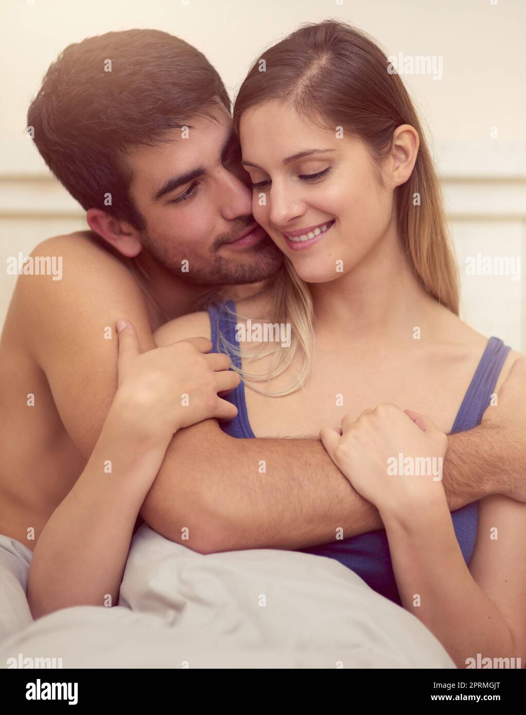 Couple hug bed hi-res stock photography and images photo picture