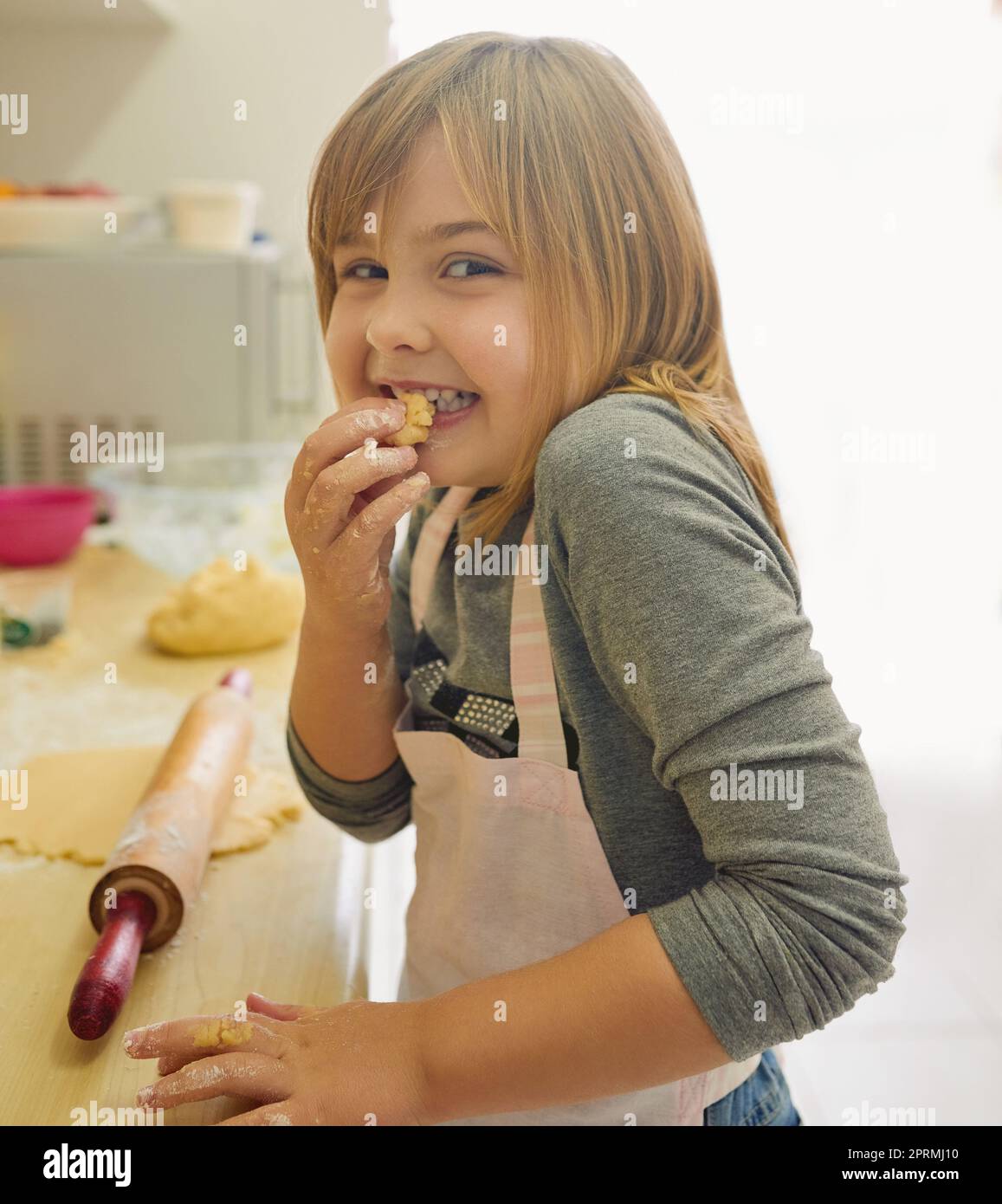 Good things come to those who bake. Portrait of a little girl baking in