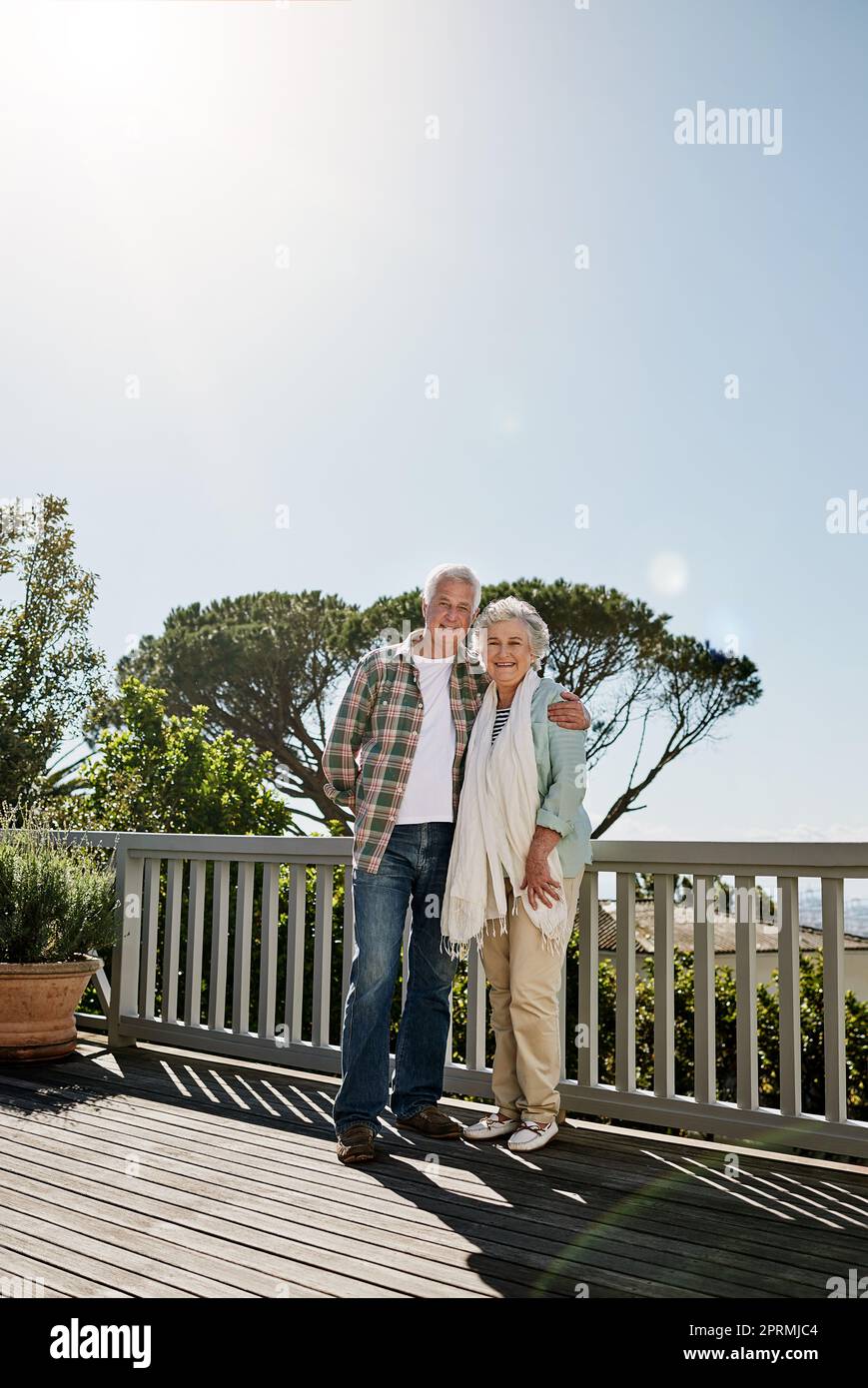 The days just keep getting better and better. a happy senior couple relaxing together on the patio at home. Stock Photo