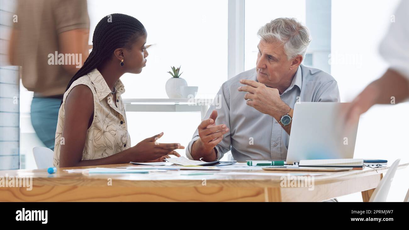 Business woman consulting company client about creative project on laptop in modern office. Corporate, meeting and black manager discussing b2b marketing strategy with industry executive on computer Stock Photo