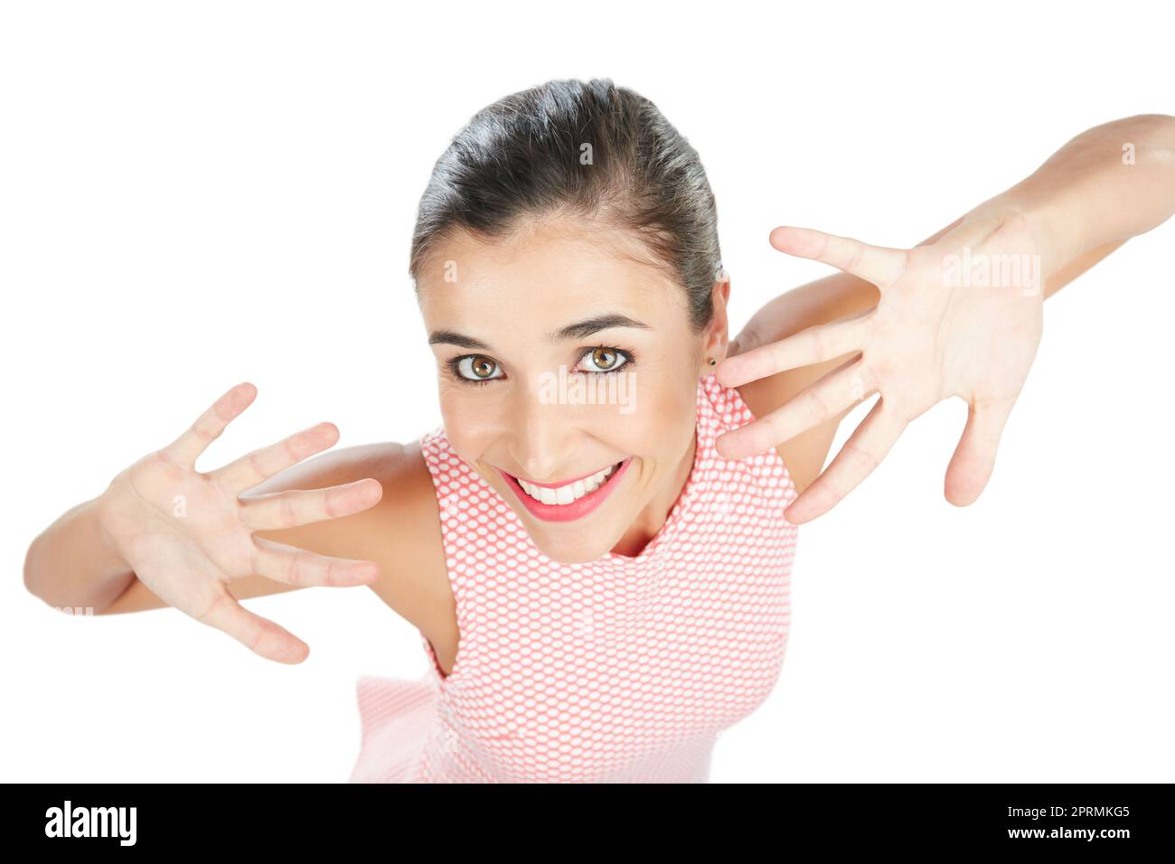 Jazz hands. High angle studio portrait of an attractive young woman posing with her hands in front of her face against a white background. Stock Photo