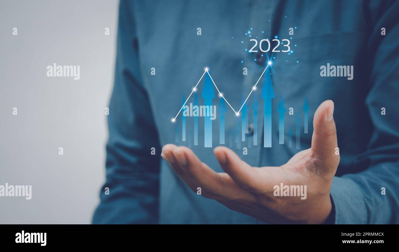 Businessman increase arrow graph corporate future growth New Goals Plans and Visions for Next Year 2023.Business finance economic development investment. Stock Photo