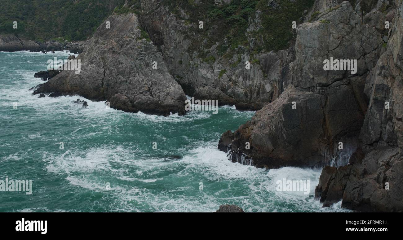 Sea waves splash against rock on island Stock Photo - Alamy