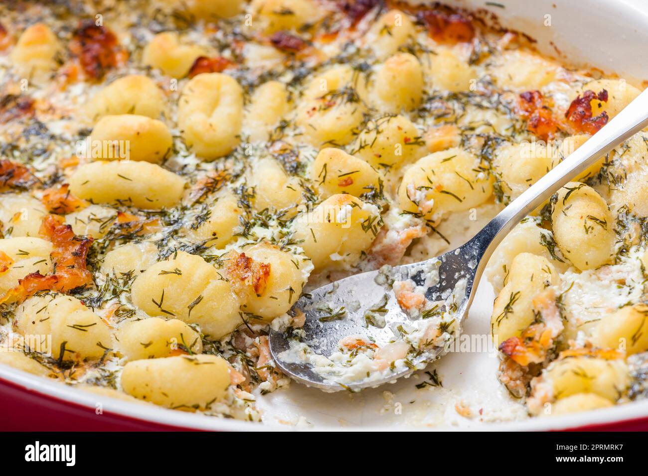 baked gnocchi with salmon and dill sauce Stock Photo - Alamy