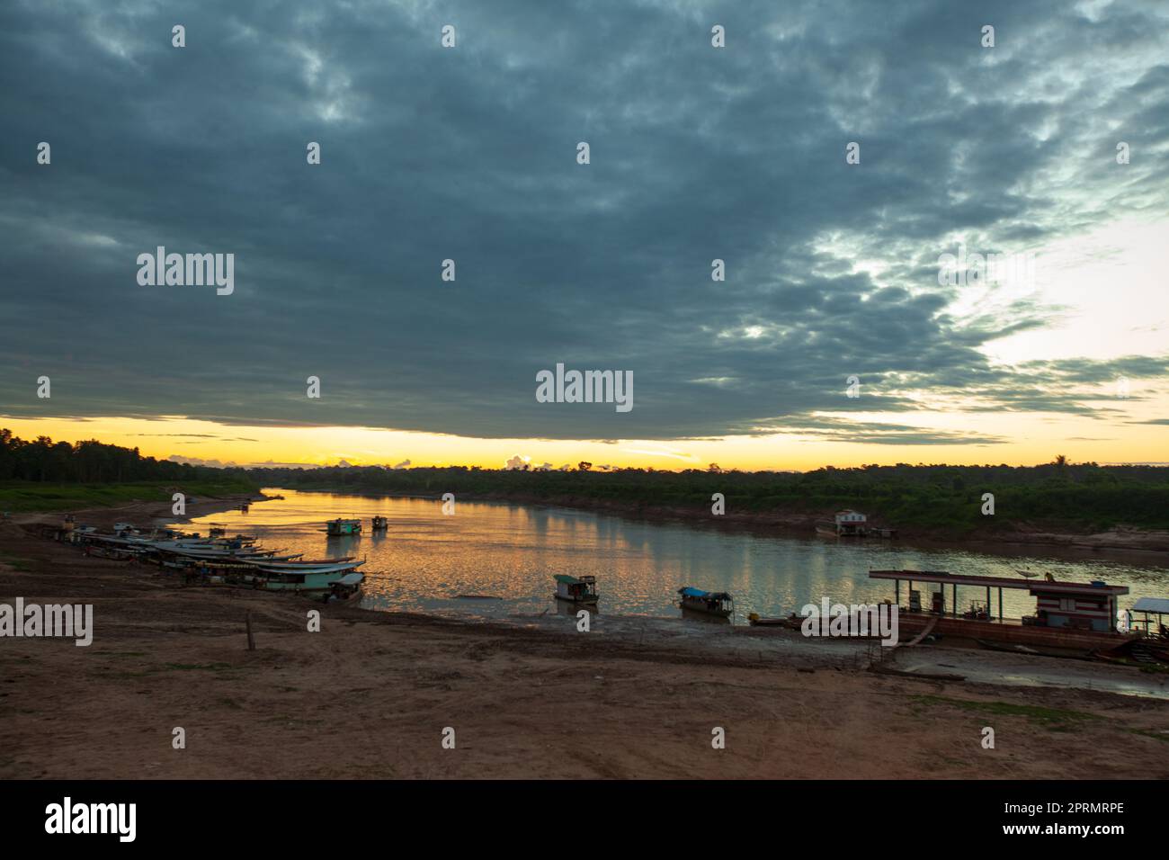 The river at dusk, where the road meets the river, Amazonia Stock Photo ...