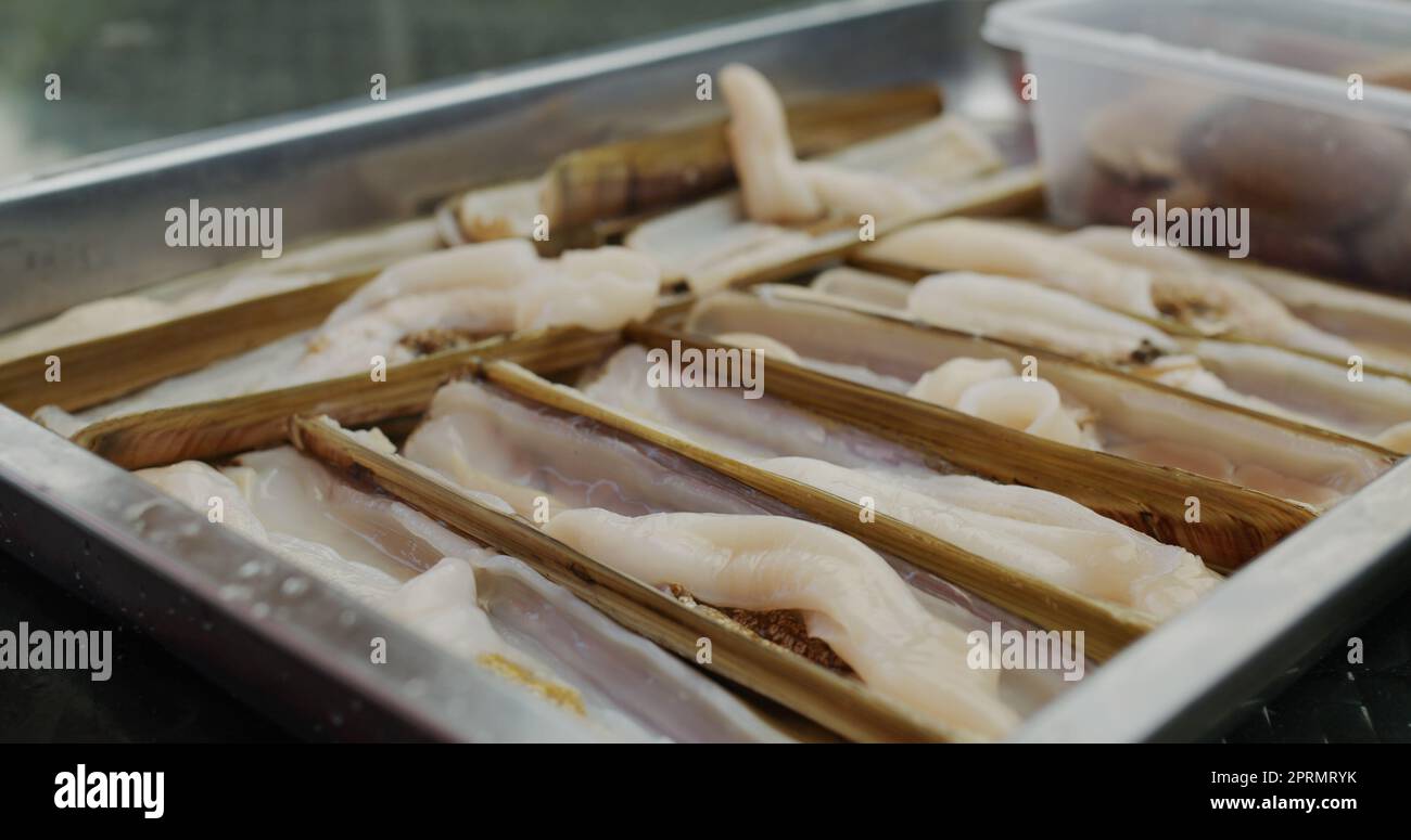 Fresh razor clam on tray Stock Photo - Alamy