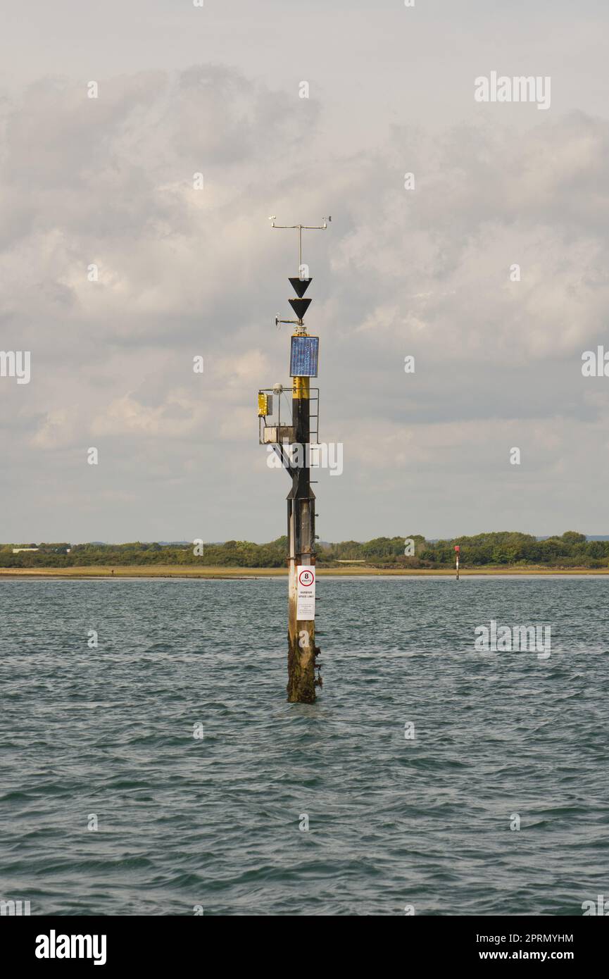 Weather monitoring station mast in middle of Chichester Harbour near