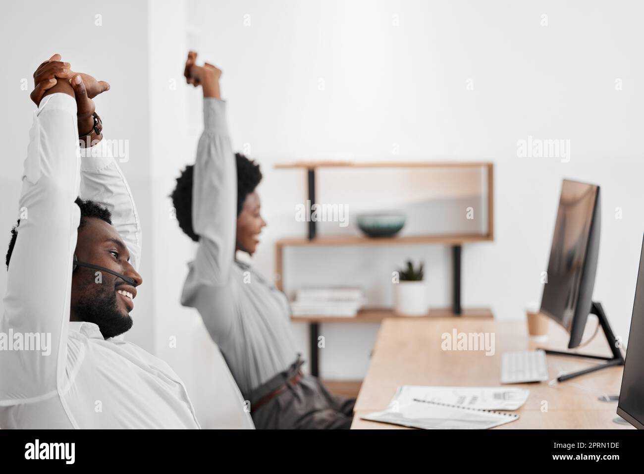 Stretching, call center and customer service people with computer 