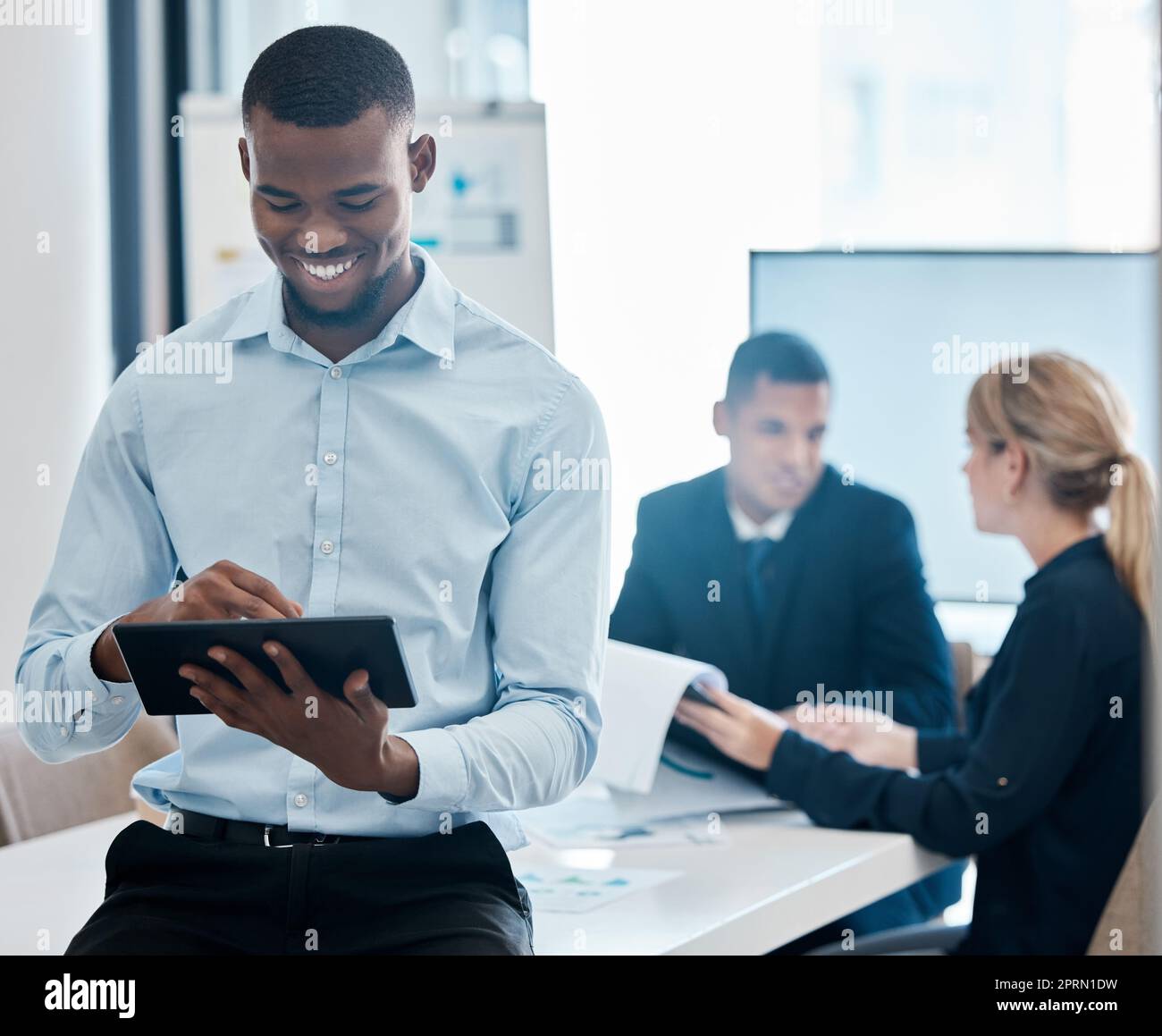 Business man, tablet and marketing research for crm while in team meeting with a smile for good feedback. Diversity, corporate and professional group of people doing planning and working in a office Stock Photo