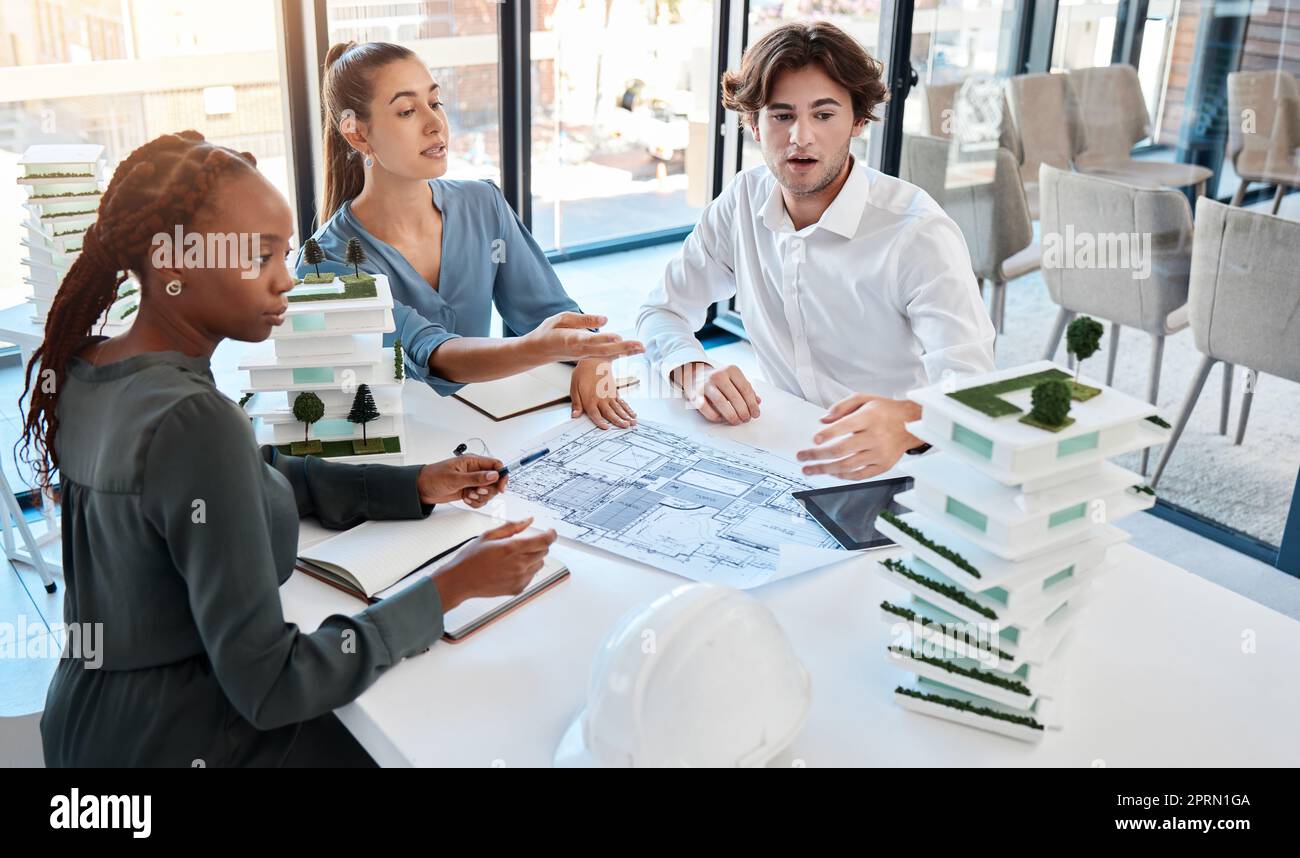 Architect team, collaboration and planning in meeting discussion for architecture design plan or 3D model at the office. Diverse business people talking in teamwork strategy for building prototype Stock Photo