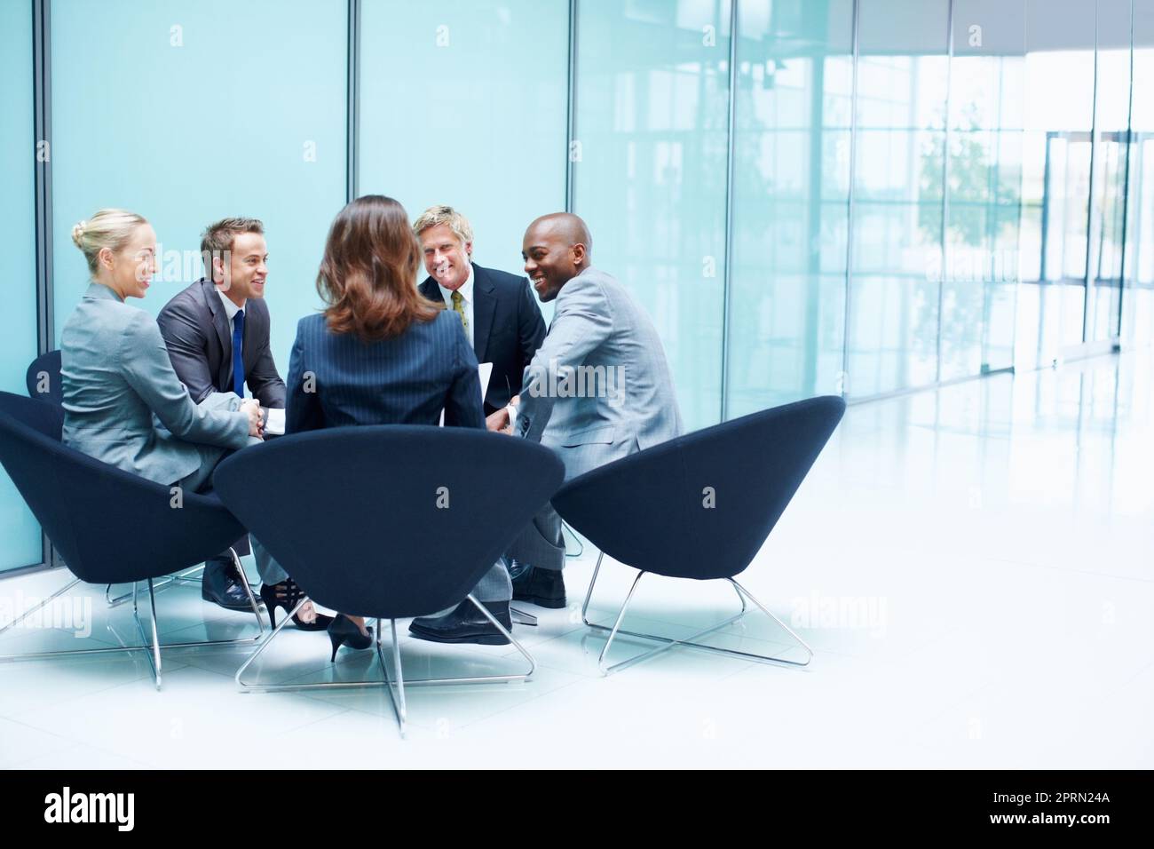 Business people in discussion. Portrait of multi racial business people discussing in meeting. Stock Photo