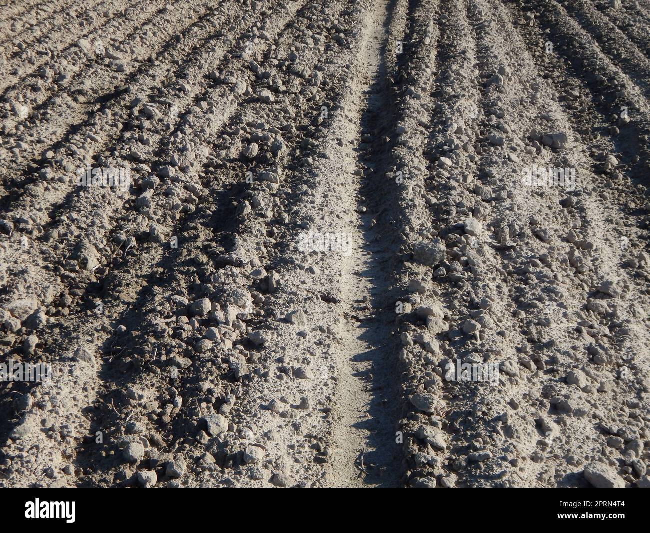 Tractor plowed field and arable land Stock Photo - Alamy