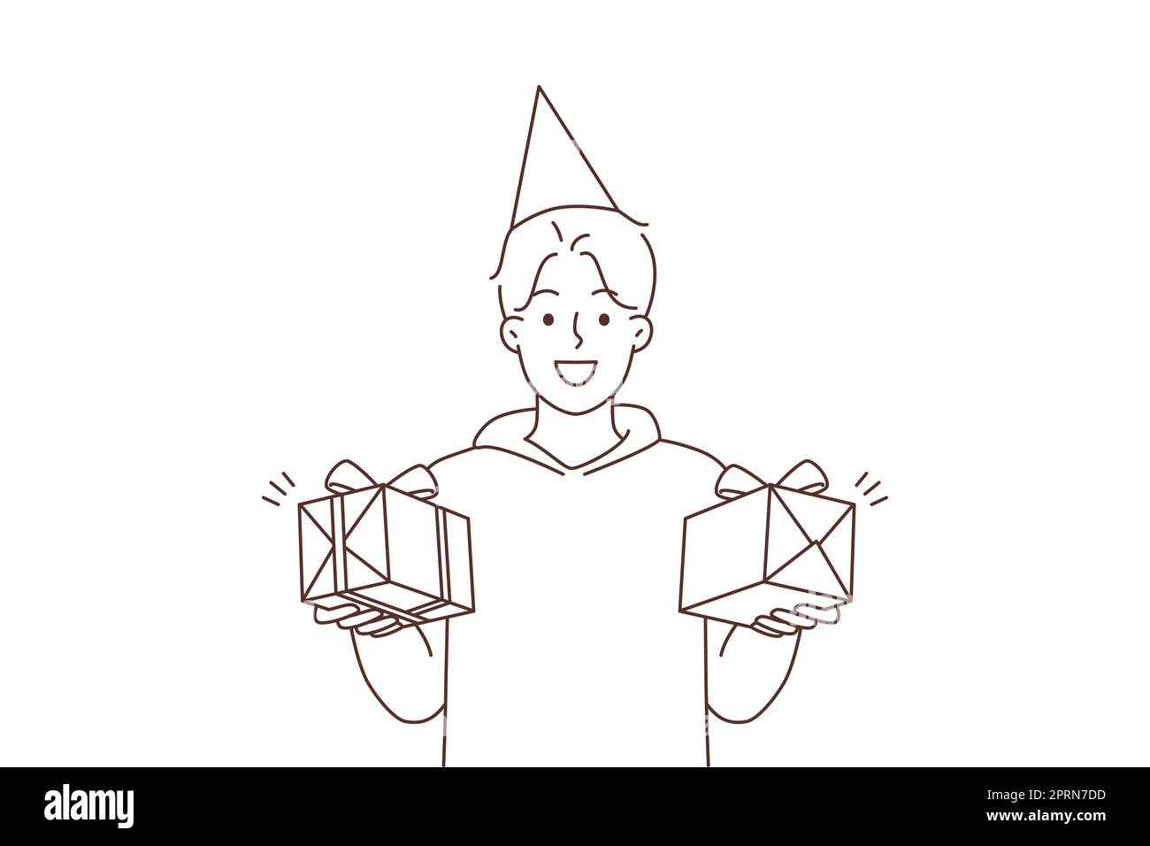 Smiling young man in birthday hat holding presents in hands. Happy guy