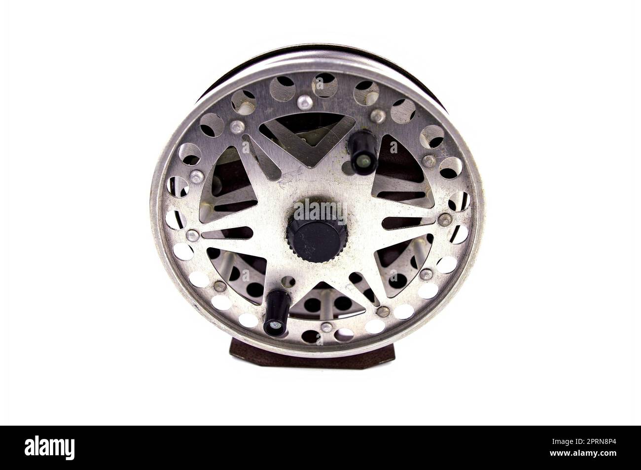 Old aluminum reel for fishing spinning line. Spinning reel. Fisherman's