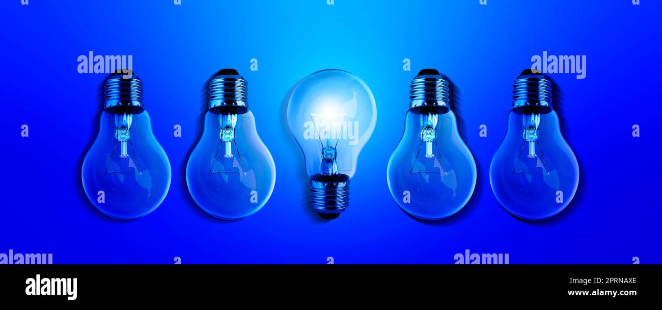 Light bulbs illuminate a row of dim lighting ideas for creativity