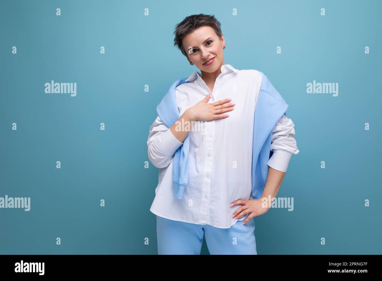 authentic young trendy dark haired woman in a cool look Stock Photo