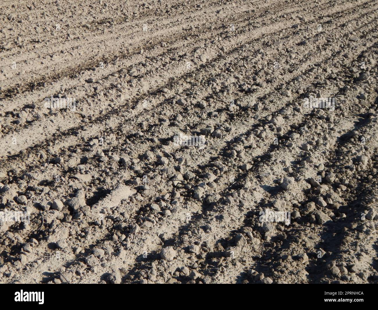 Tractor plowed field and arable land Stock Photo - Alamy