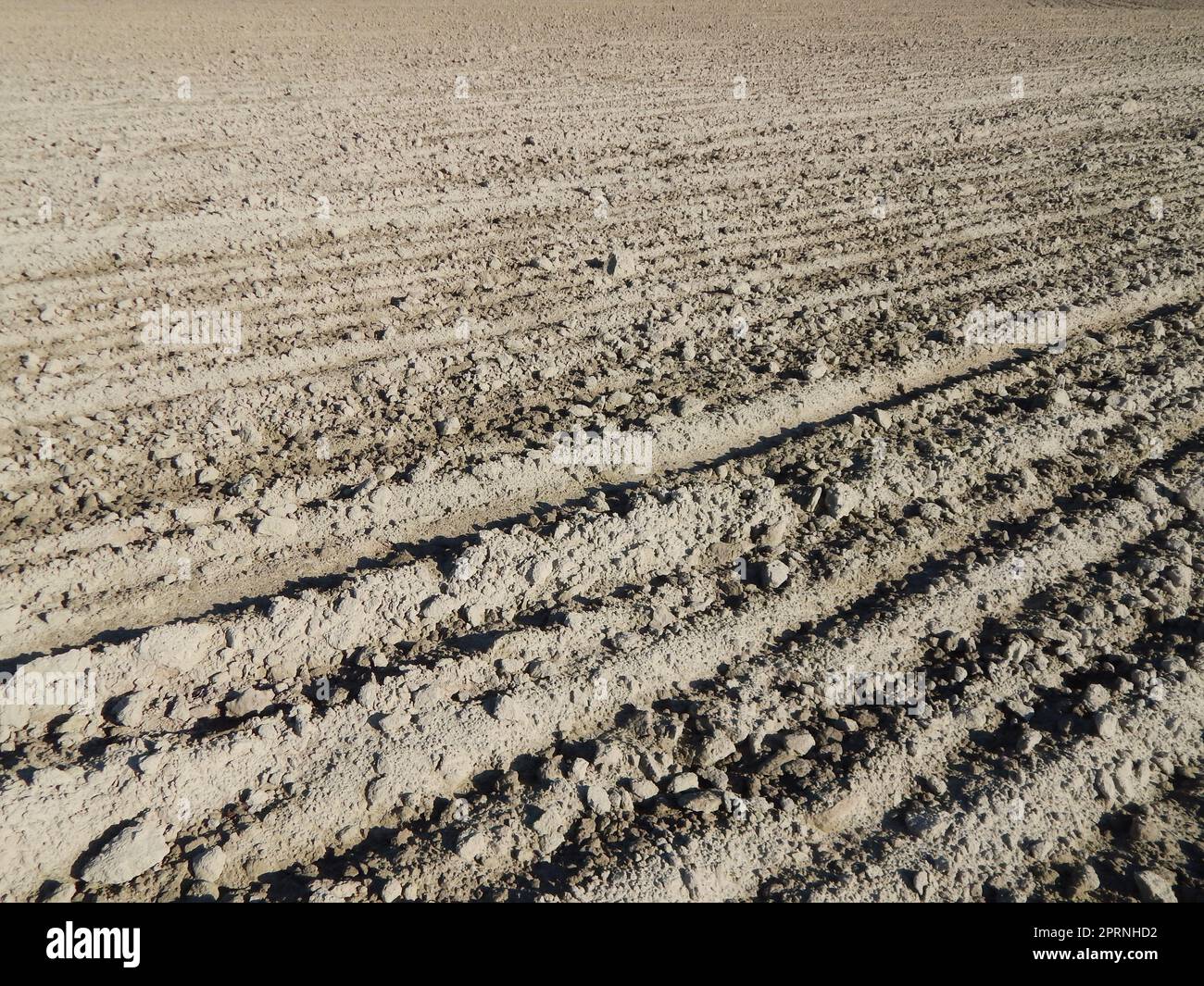 Tractor plowed field and arable land Stock Photo - Alamy