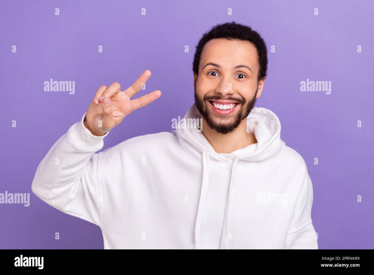 Portrait of positive satisfied person beaming smile arm fingers show v ...