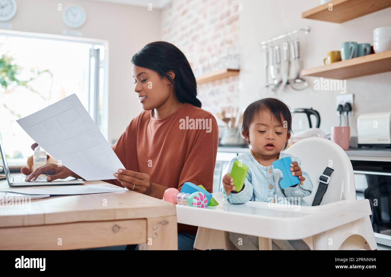Mom multitasking in kitchen hi-res stock photography and images - Alamy