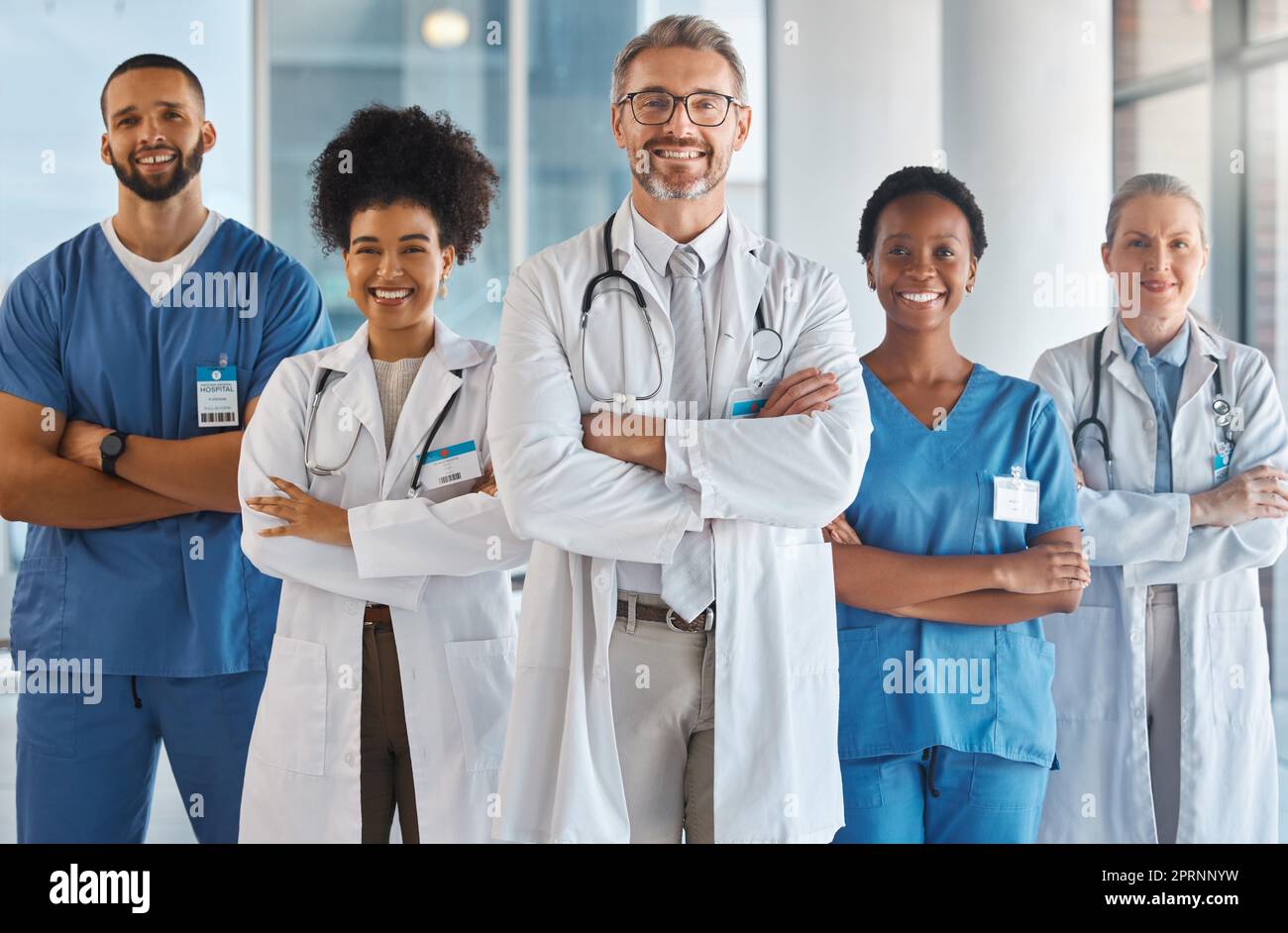 Doctor, team and hospital at work smile together for portrait in