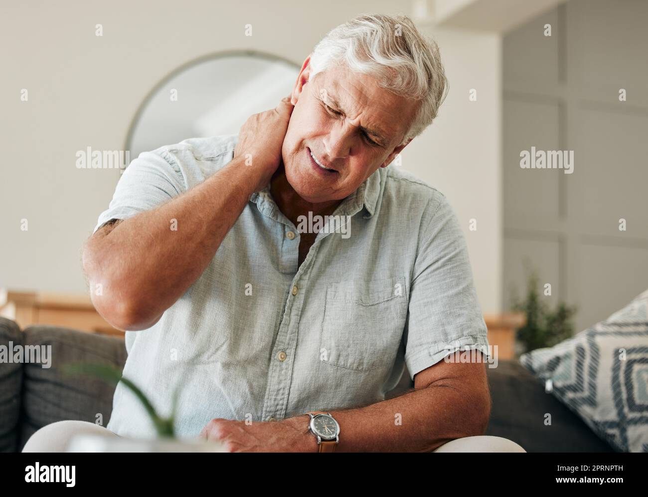 Senior man, neck pain and stress sitting at home with spine injury