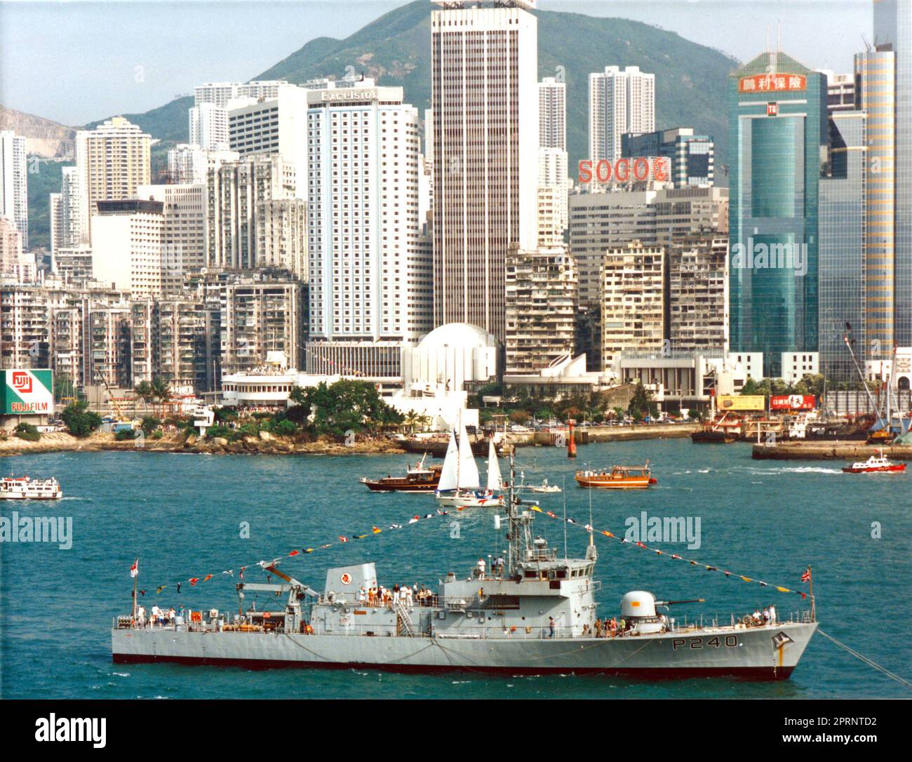 HMS Plover (P240), dressed overall as guardship for an event at the Royal Hong Kong Yacht Club, circa 1996, before the handover to China in 1997. Stock Photo