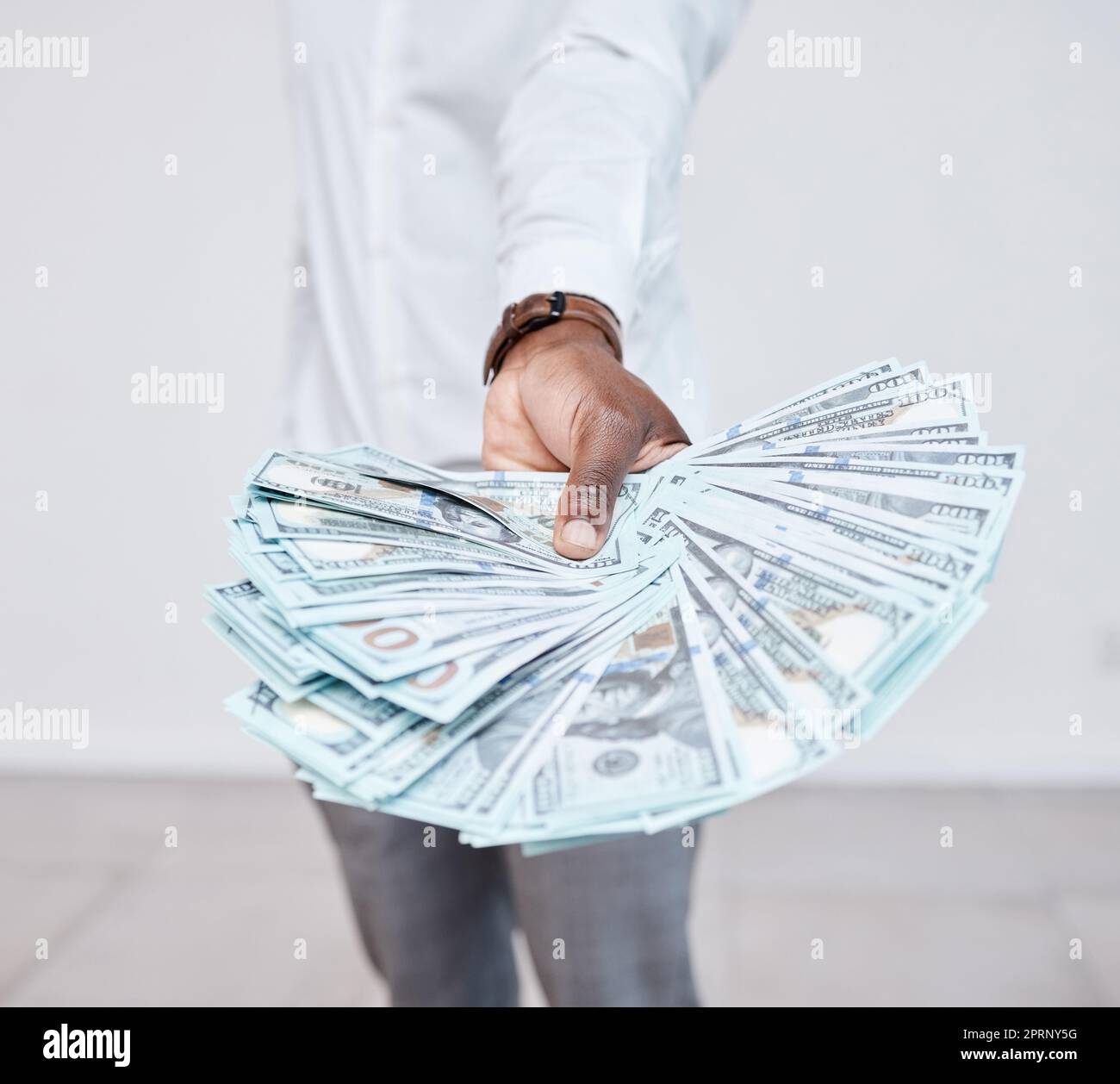 Hands of black man with dollars, money or cash, payment or profit from commerce. Finance, wealth and rich person with offer, exchange or accounting transaction, trade or financial business deal. Stock Photo