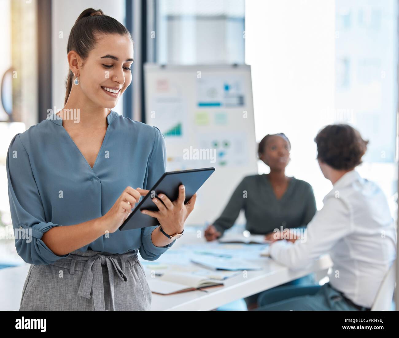 Leadership, management and leader with tablet working on future innovation idea and analyzing data. Collaboration, teamwork and planning at strategy business meeting with diversity team and graphs Stock Photo