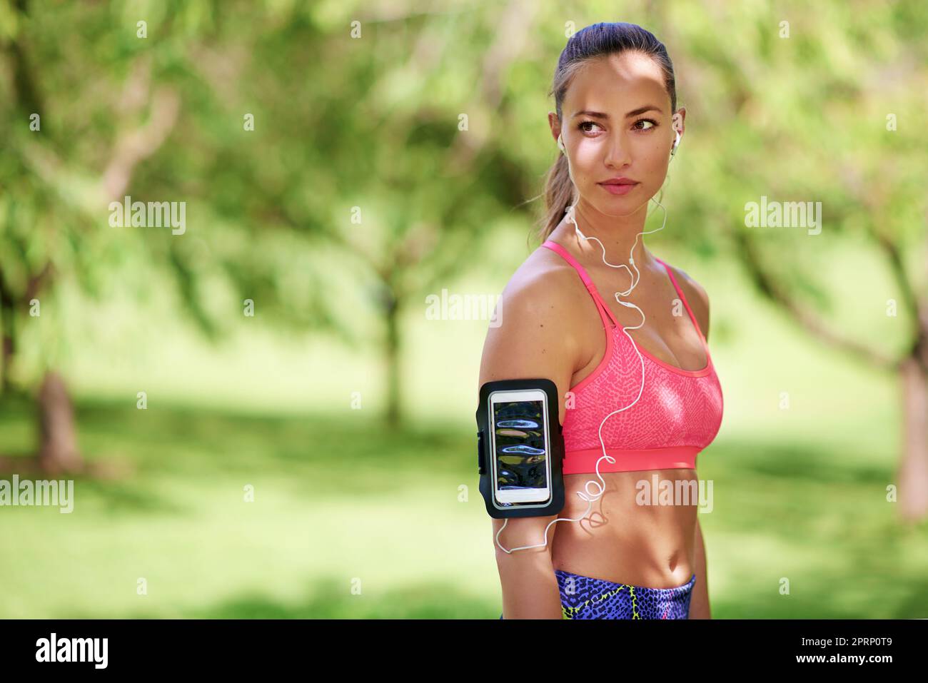 Turn intensions to actions. a sporty young woman at the park. Stock Photo