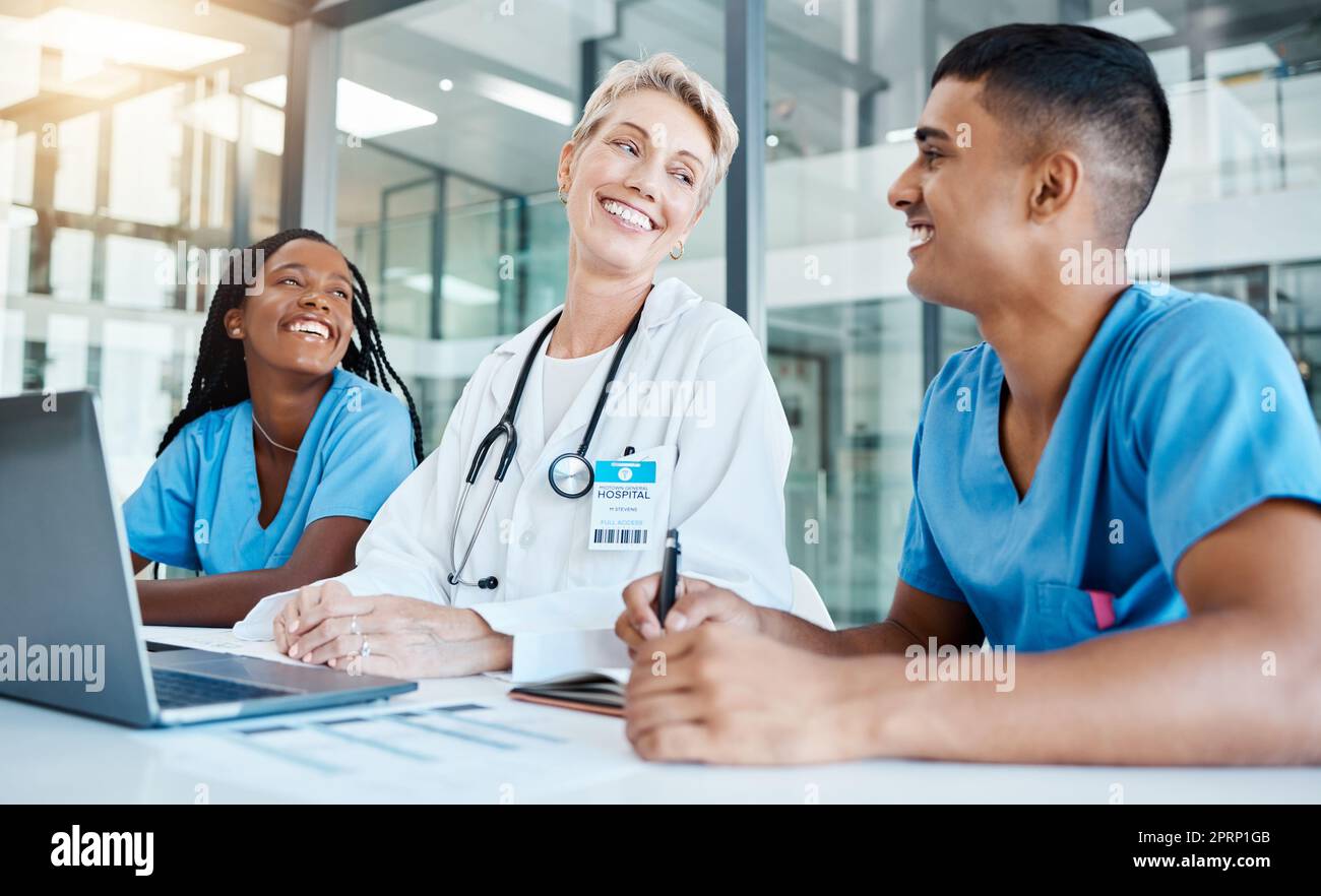 Doctor, nurses and laptop meeting with and medical lab data for idea innovation in medicine research at hospital clinic. Smile, happy and motivation healthcare teamwork planning surgery for insurance Stock Photo