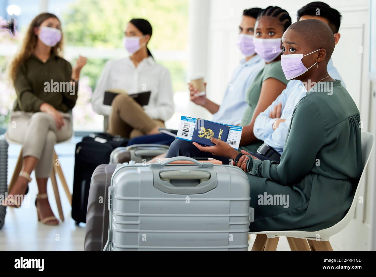 Travel, passport and covid compliance people with mask at airport for safety from corona virus traveling business class. Business people in global inclusivity with airplane ticket and luggage Stock Photo