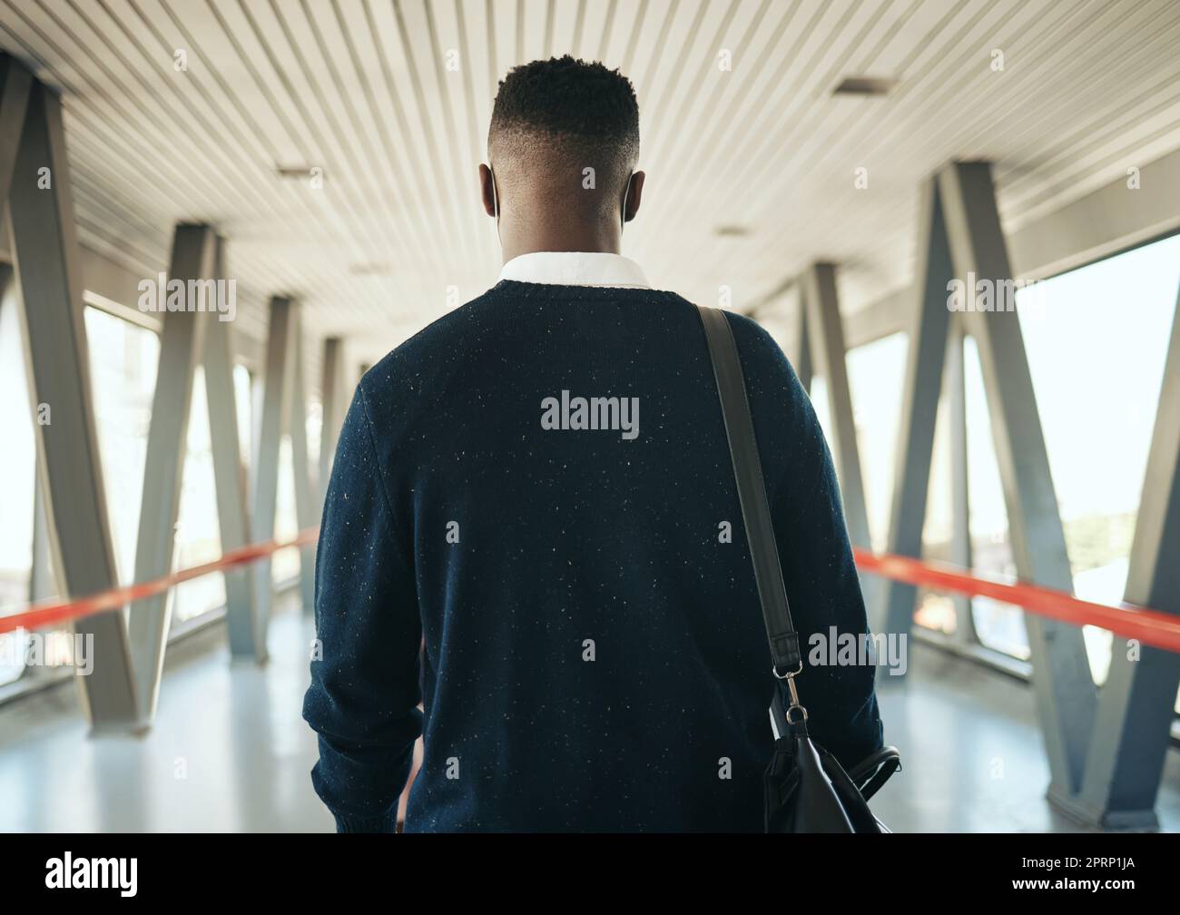 Travel, vision and black business man taking trip to meeting or global networking seminar, rear view of entrepreneur at the airport. Young professional on mission to upskill and achieve career goals Stock Photo